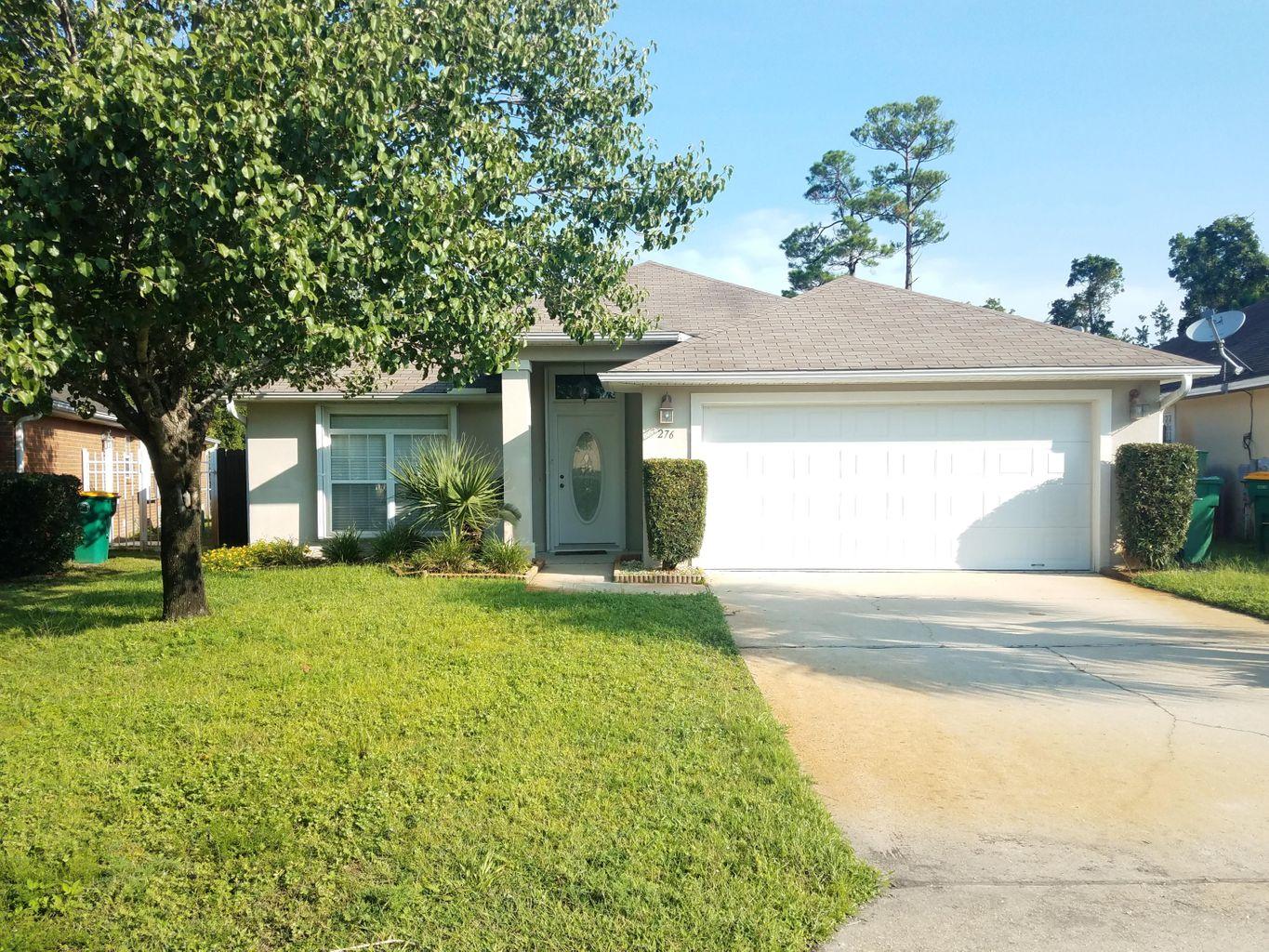 Gated Community with sound front neighborhood. Minutes shopping mall, beaches, Hurlbut Field and Eglin AFB. A great floor plan with 12ft ceilings with spanish laced ceilings and walls. Upon entry notice chair rails to add accent and beautiful neutral tile throughout (carpeting in BR). Great room has treyed ceiling w/ accent lighting and fireplace with tv built-in area above. Kitchen has granite countertops with stainless steel appliances and breakfast bar. *Master bath has his and hers closets and garden tub.Lighting upgrades throughout (all on dimmers) with ceiling fans in every bedroom. Roof-2021,L fence 2020, painted 2019,dishwasher 2019,refrig 2018,Hurricane Shutters 2018,Microwave 2018,HVAC 2018,termite bond renewed March 2021, not in flood zone