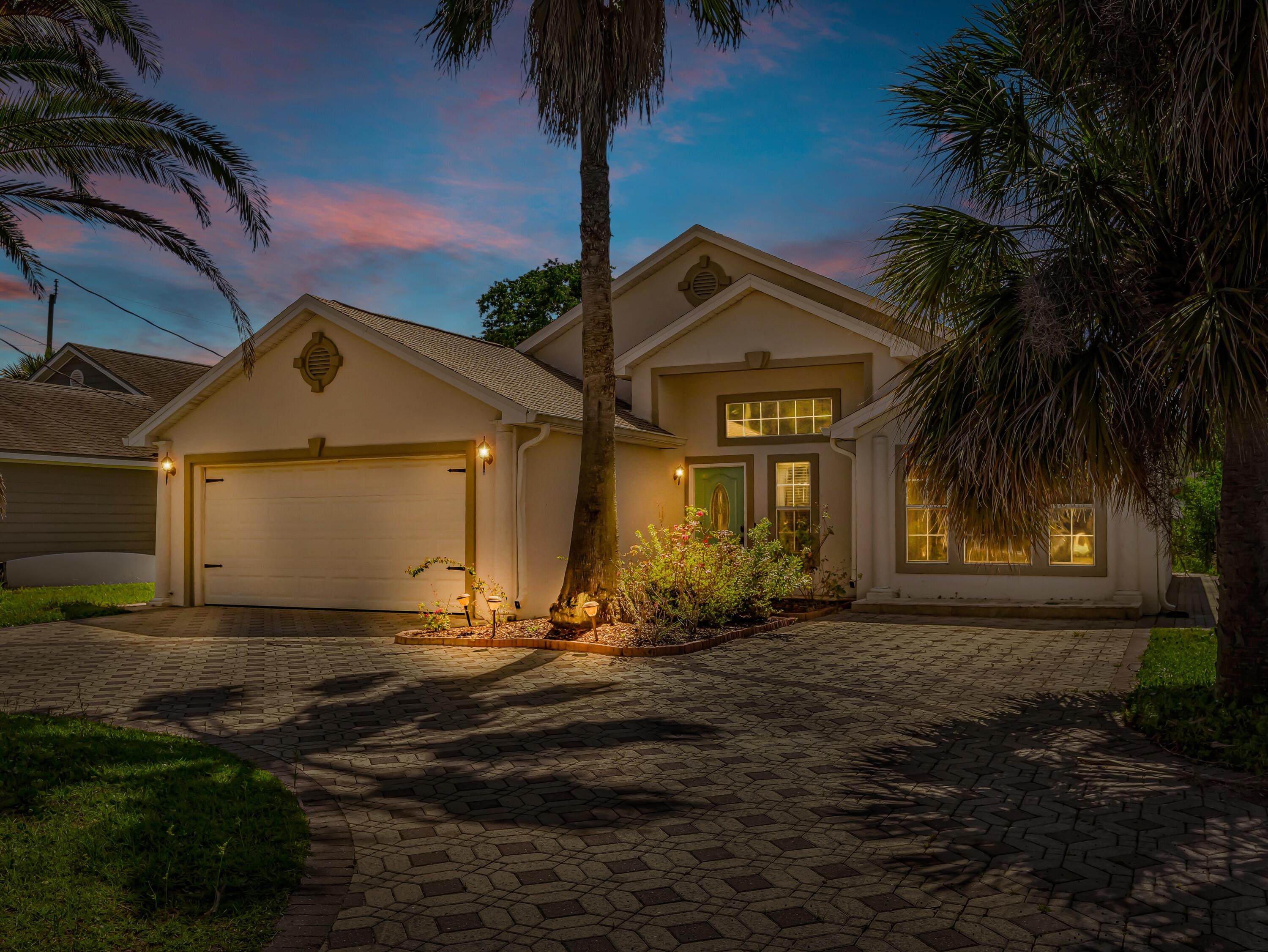 This home is conveniently located in the heart of Miramar Beach and the bay, in an exclusive community featuring only 16 homes and a community pool! Perfect for a second home or full-time residence, this home features a split-bedroom, open floor plan and vaulted cathedral ceilings. The living room features travertine & marble flooring. a brick paver driveway. The roof was replaced in 2021 and the exterior stucco in 2016. Short term rentals with a 30-day minimum is allowed.
