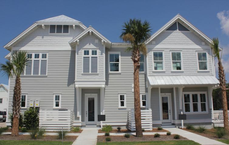 The perfect two bedroom townhome all on one level! The Aruba plan has an open living and dining room with French doors opening to the South facing covered balcony. The bedrooms are placed on opposite sides of the home, perfectly designed for a full time residence or second home. The Aruba features a full size laundry room, walk-in master closet, stainless GE Stainless steel, appliances, granite countertops, gas cooktop, tank less water heater and wood flooring.