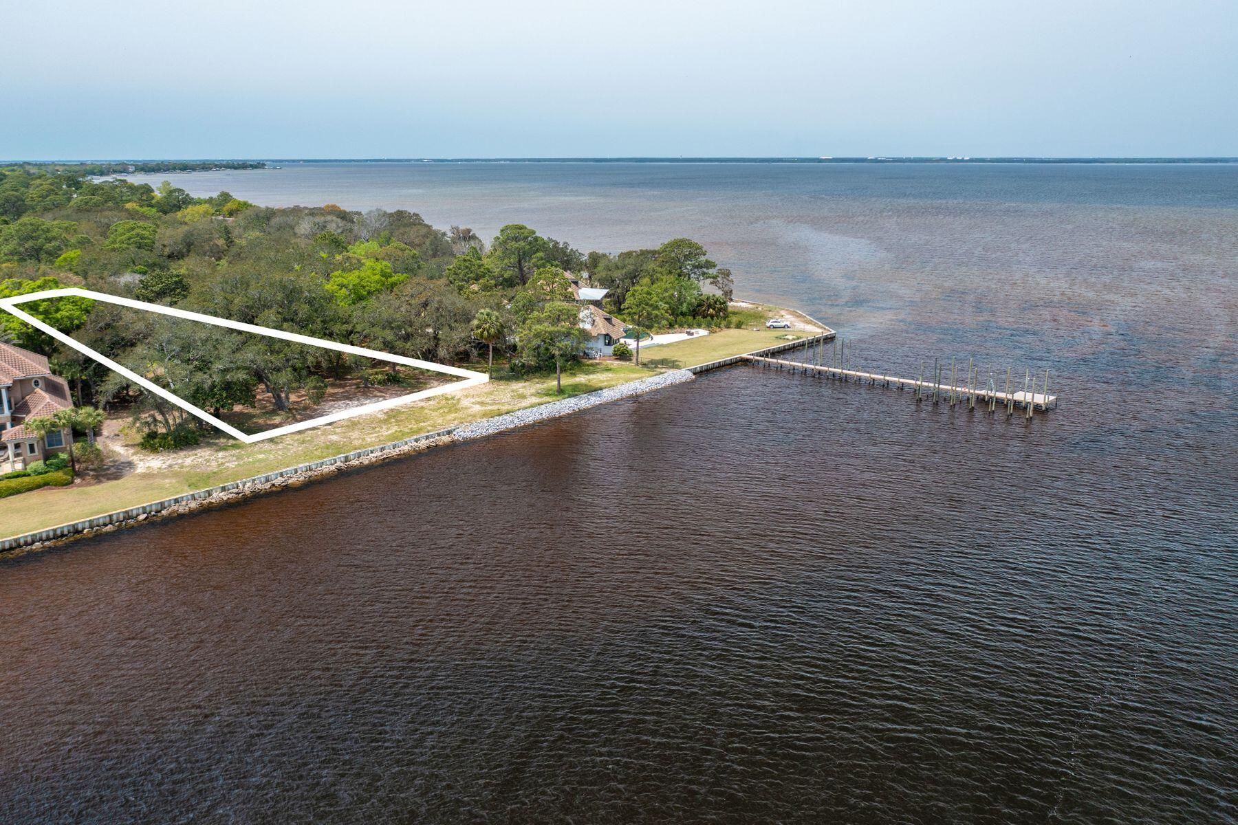 The Estates at Indian Pointe is an exclusive gated community with only 13 homesites on Choctawhatchee Bay. This .66 acre lot features 145 feet of bay frontage, essential for the avid boater. The community features brick sidewalks, paved stone street surfaces, wrought iron lamp posts and a central sitting area complimented by mature, natural vegetation to combine classy character with privacy in a waterfront setting. Offering an extraordinary lifestyle where one can enjoy life on the water yet just minutes away is all Destin's has to offer with the world's best beaches, shopping, dining and golfing. It's ideal for the boating enthusiast and yachtsman alike with easy access to the Gulf by way of the Destin Harbor.