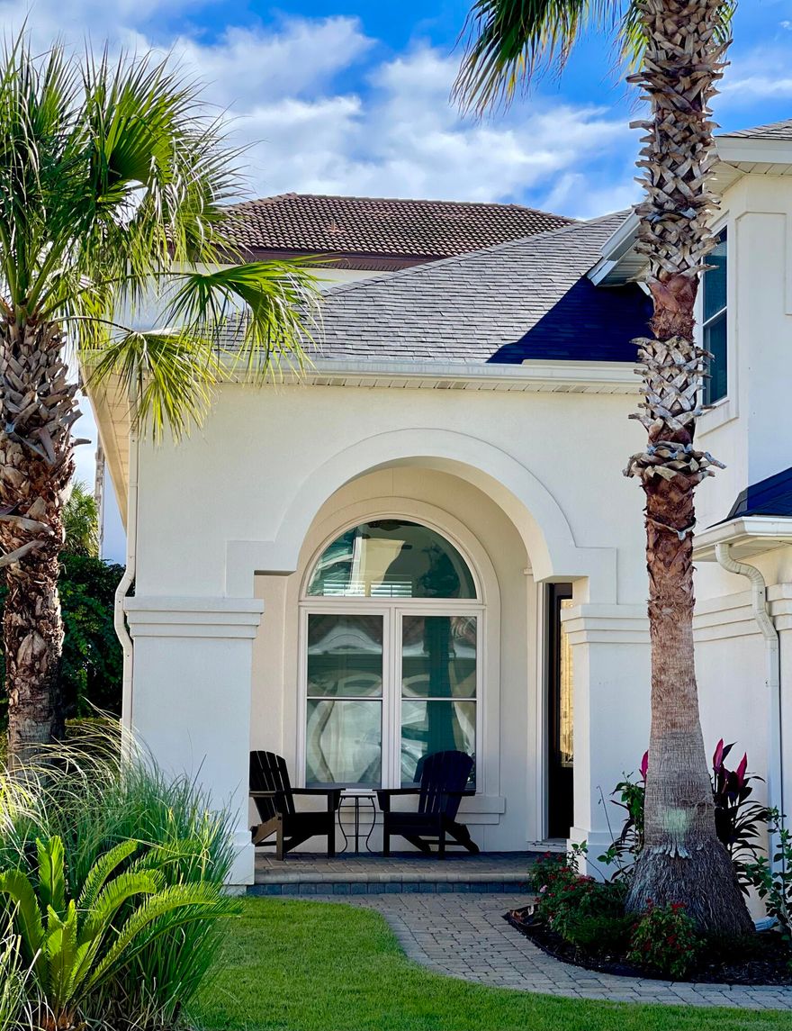 Premier location! Elegant custom-built home with PRIVATE beach just 150 yards from your front door. New floors, impact windows, high end appliances, solid core doors, televisions in every bedroom & new contemporary furniture means this house is perfect as a primary residence, second home or rental investment. There are 2 master bedrooms, one on the first floor. The oversized living room with its two-story ceiling is adjacent to the family room which boasts a gas burning fireplace. The second master bedroom, two guest bedrooms plus a loft/bedroom/office space complete the second floor. A pull-down staircase to the attic insures plenty of storage -in case the 8 closets & pantry are full. There is a 2 1/2 car garage that has room for a golf cart. Outside the spacious backyard has a newly tiled