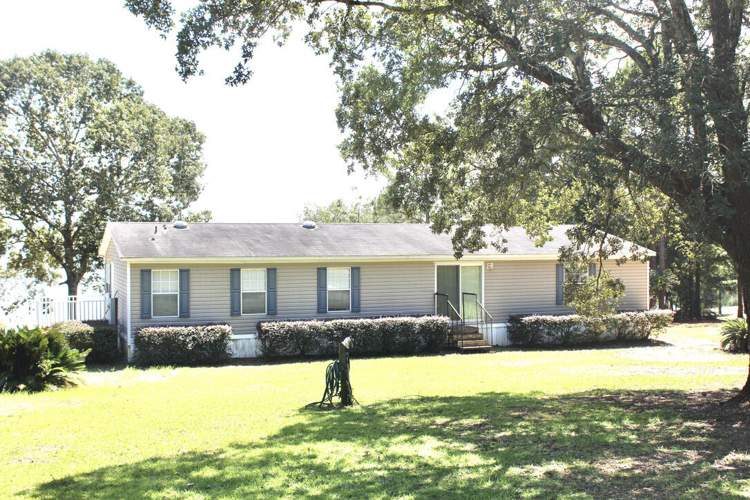 WATERFRONT KING LAKE!! The 1650 SF mfg. home is in excellent condition and sits on 2.6 waterfront acres on King Lake, one of the areas finest big bass fishing lakes. You will love the spectacular view from the front porch The home is partially furnished. All furniture & personal items in the home are included in the sale. Easy to show. Better hurry.! Waterfront property with 2.6 acres is very hard to find in today's market.