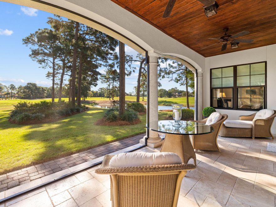 Set on an oversized lot, this Italian-style villa enjoys peaceful golf and lake views yet it's just a short golf cart ride from Sandestin's amazing shopping, restaurants and amenities. A generous brick paver driveway leads to a full one-car garage and an impressive front entrance. Inside, the home is beautifully presented with Jerusalem random etched stone flooring flowing through each elegantly furnished space of the first floor. High ceilings with crown molding and multiple windows enhance the light space, but the focal point is the stunning fairway view through three sets of full-height French doors. The screened patio is double the size of most in Villa Lago and provides a surprisingly private haven for enjoying tranquil views through mature pines and enhanced landscaping. The gourmet kitchen showcases an enviable array of custom cabinets, quartz countertops and KitchenAid stainless appliances. There's a walk-in pantry providing organized storage while the breakfast bar creates a social space for hanging out with the chef. Beneath a glittering chandelier, the dining room is sure to be the gathering spot when entertaining family and friends. The first floor includes a half-bathroom, enviable storage and a primary suite with walk-in closets, built-ins and a sitting area with peaceful views. The bathroom is amply fitted out with a dual quartz vanity and an oversized shower. Upstairs, all three bedrooms have quality walnut flooring and ensuite baths. One of the bedrooms is  an additional master suite with a generous private balcony providing a quiet retreat for sipping coffee and enjoying a good book. The laundry room is sizeable with ample cabinets and a stackable washer-dryer. Additional touches include two new HVACs, custom light fixtures and fresh paint.  Although it has never been rented, this fully-furnished home is offered with a 6 seater golf cart in a rental-permitted neighborhood, and would make an amazing primary or second home. Sandestin Golf and Beach Resort is known for its outstanding recreation with four championship golf courses, community pools, a marina, watersports and a complimentary shuttle to seven miles of soft white sandy beaches. Grand Boulevard is a shopper's dream while Baytowne Wharf offers a magnificent choice of waterfront dining and entertainment. Life surely doesn't get better than this.