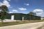 New construction 7,000 square foot warehouse conveniently located in Downtown Freeport, just one block south of Highway 20. This building has 6,400 square feet of warehouse space and 600 square feet of office space. Two bathrooms, one in the office with a shower and the other in the warehouse. Two 12'x12' roll-up door entrances, one on each end of the building, each connected to a driveway entrance and parking.