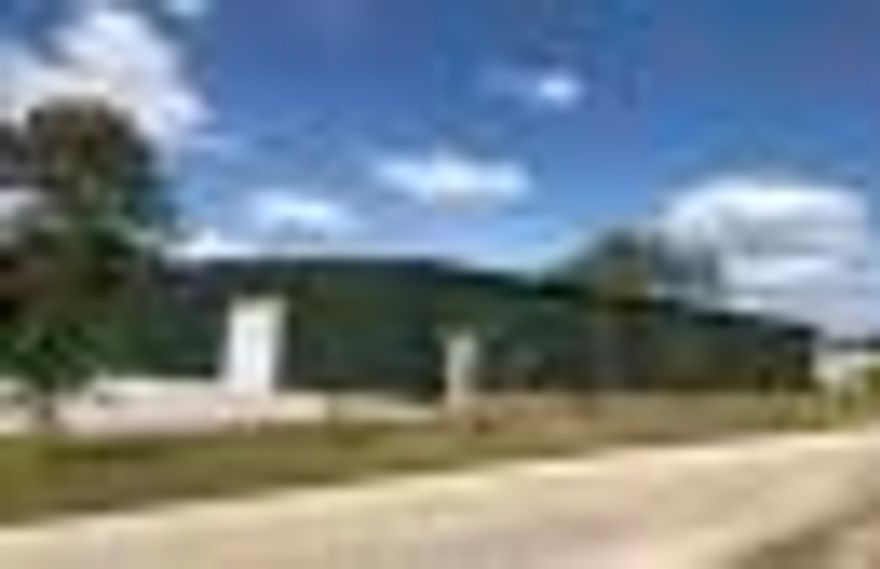 New construction 7,000 square foot warehouse conveniently located in Downtown Freeport, just one block south of Highway 20. This building has 6,400 square feet of warehouse space and 600 square feet of office space. Two bathrooms, one in the office with a shower and the other in the warehouse. Two 12'x12' roll-up door entrances, one on each end of the building, each connected to a driveway entrance and parking.