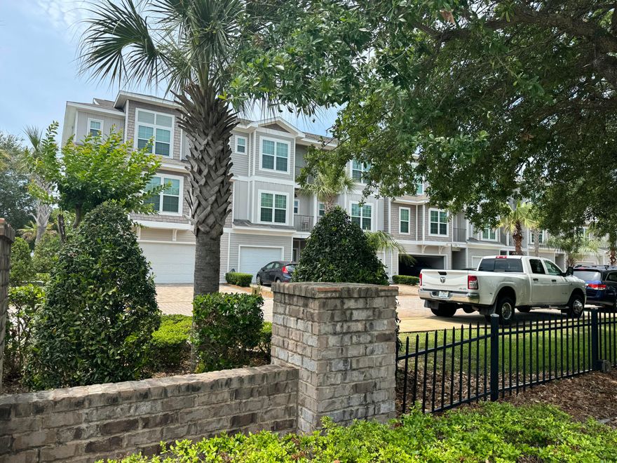 INVESTMENT OPPORTUNITY!! This 4 bedroom, 4 bathroom FORMER MODEL home comes FULLY FURNISHED! This gorgeous home has options of being a vacation rental, 2nd home or full-time residence. It was professionally decorated by Tuskers Home Store. 2025 reservations are already on the books! It is located in a quaint community of only 20 residences known as Driftwood Drive Townhomes.  It is footsteps from the sugar white sand beaches, public beach access w/restrooms and shower, world class fishing, and local dining. This property is modern, energy efficient, and has luxurious appointments. Built in 2017 as an 'earth cents' energy efficient home it has cement board siding, impact glass, insulated garage door, tiled garage floor, and 50 gallon hot water tank with dehumidifier pump built in. There is porcelain tile, beautiful oak hardwood floors, and crown molding throughout. The first floor has a spacious bedroom with two custom built-in bunk beds, a full bath & a full size stackable washer and dryer. The second floor features a large kitchen with granite countertops, Frigidaire Gallery stainless steel appliances, and a large maplewood island perfect for entertaining a crowd. There is also a large bedroom and full bathroom located conveniently off the kitchen. On the third floor, you will find the master bedroom with the gorgeous ensuite bath; a luxurious oversized shower & soaking tub as well as another bedroom with a private bath and a second washer and dryer hookup.  Outside, you'll find the backyard is perfect an evening BBQ. There is a community pool complete with a surrounding sun deck area and restrooms. This is an opportunity to own that beach house you have been dreaming of! This property comes fully-furnished, rental ready and is thoughtfully designed to welcome all your guests.  Make wonderful family memories or a great investment!