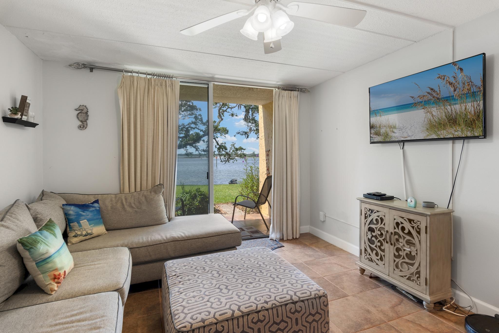 AMAZING LOCATION ON THE INTRACOASTAL WATERWAY! The views are breathtaking from this 1st floor fully furnished unit. This clean and easy to care for unit features 2 Large Bedrooms and plenty of indoor/outdoor storage space. Enjoy stunning views right from the Large living/dining room. The kitchen is equipped with all essential appliances and a sizable pantry! All tile throughout this beautiful unit. This home is conveniently located steps from the pool, and walkway leading right to the water and community dock along the Intracoastal. Cedars boasts very beautiful common areas and a courtyard area lined with gorgeous live oaks. This is true waterfront living.