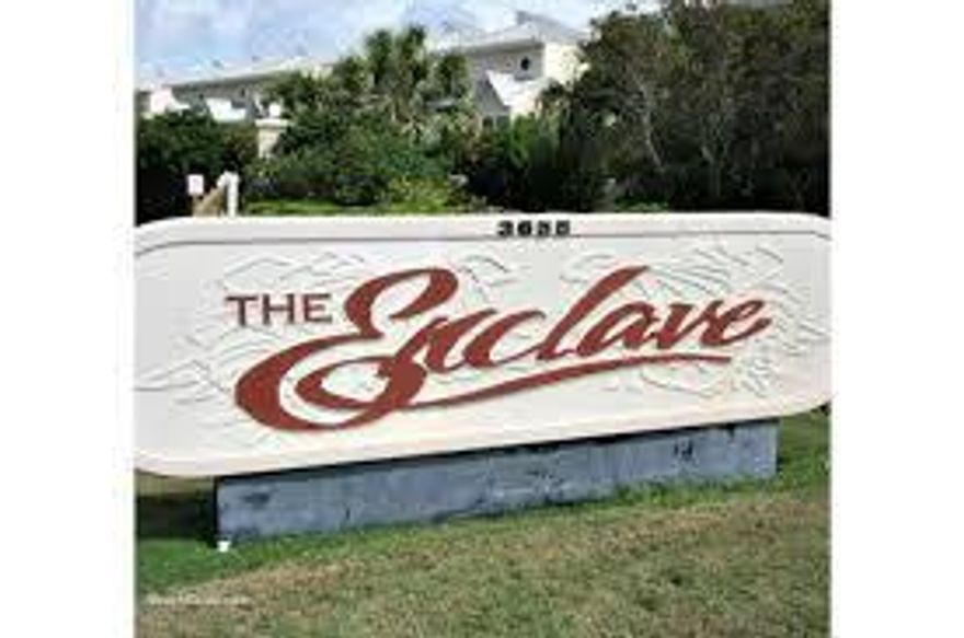 RARE FIND-Low Density two building complex on 4.5 acres. Gated and Deeded beach access steps away from the emerald waters and sugar white sand. The Enclave offers heated solar pool for the cooler months, basketball, tennis and sand volleyball courts, community room, owner parking garage, covered bike storage rack, separate storage. This condo is UPDATED, spacious and is rental ready or a great second home or primary residence. VA approved!