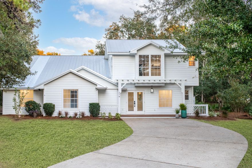 Newly renovated and elegantly designed, this stunning Seabreeze home offers 2,800 square feet of luxurious living space + an oversized porch with electric rolling screens and surrounded by wooded views in a quaint non rental neighborhood that is situated less than 1/4 mile from DEEDED beach access. The main floor offers a wide entryway with mudroom built-ins leading into a massive open-concept kitchen, dining, and living area. This brand new, fully equipped kitchen features stainless steel KitchenAid appliances, wood cabinetry with under-cabinet lighting, quartz countertops, and modern brushed brass fixtures.