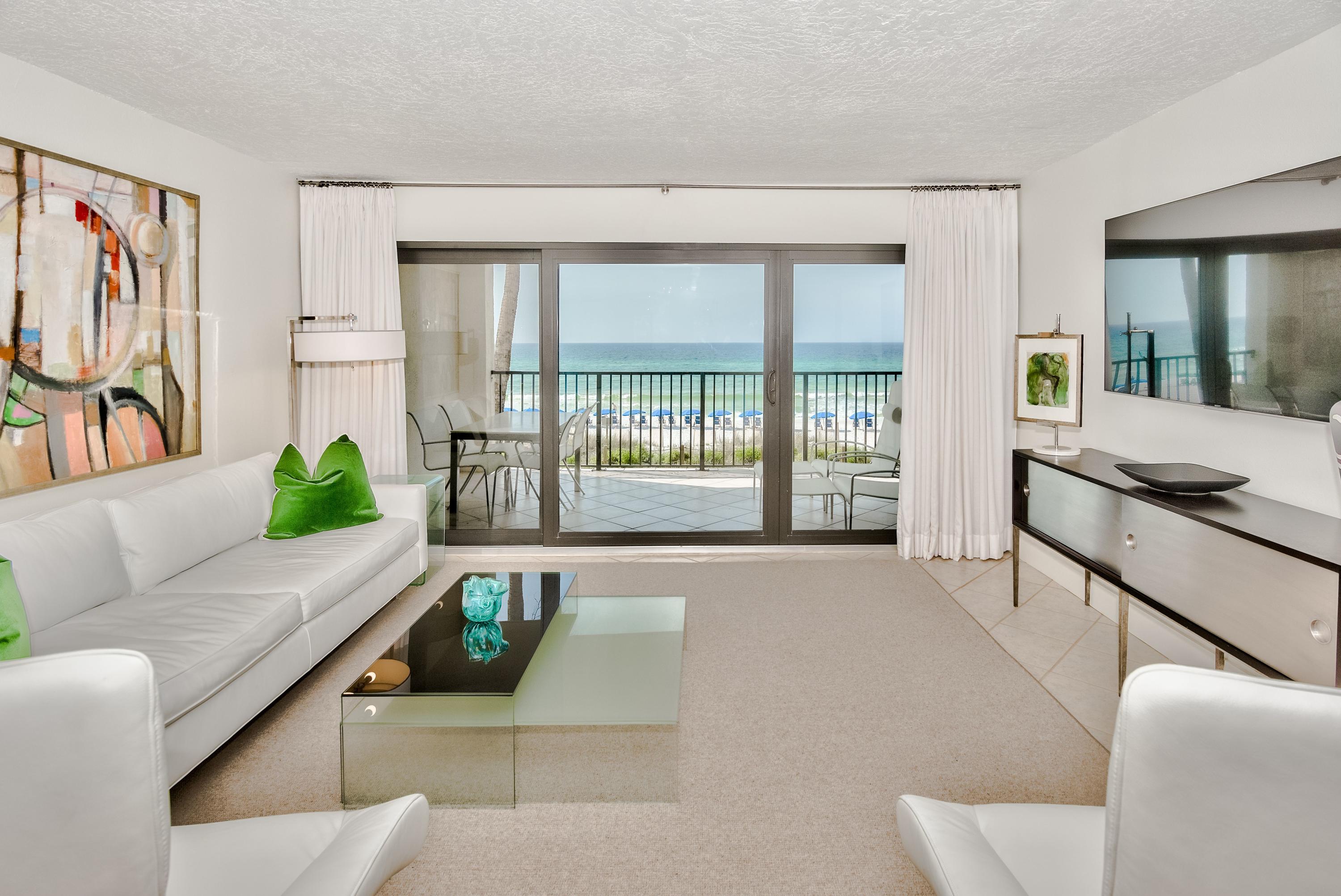 This immaculate unit has modern touches but still welcomes you to the beach from the moment you walk in the door. High end finishes throughout and a master suite with a remarkable view. Huntington by the Sea is peaceful and highly sought after complex for a reason. It's gated privacy and low density vibe are just a couple reasons these units don't sit around for sale long.