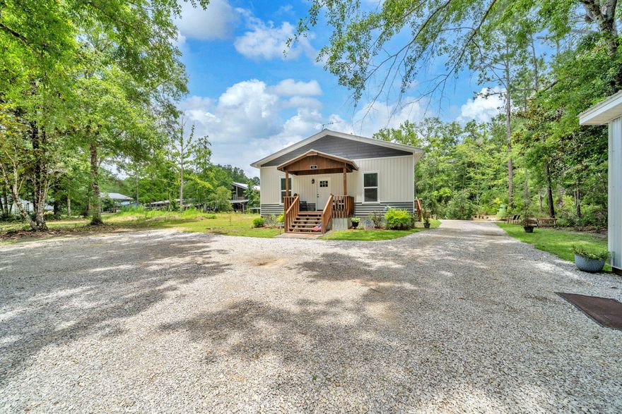 Nestled in nature and a true hidden gem in Walton County, this beautifully designed canal-front home in the peaceful waterfront community of Bunker Creek, offers the ultimate riverfront lifestyle. Perfect for outdoor lovers and fishing enthusiasts, it's just minutes by boat to Choctawhatchee Bay, the Gulf, and Florida's pristine springs. With easy deep-water access and close proximity to Crab Island and Destin, enjoy endless adventure, relaxation, and wildlife--all from your own backyard.This inviting 3-bedroom, 2-bathroom retreat offers a perfect blend of modern comfort and rustic charm and is situated on a spacious lot in a private setting with serene water views along the 67'' of canal waterfrontage with your very own concrete boat ramp. Step inside to discover a light and airy interior with soaring ceilings, wood-style LVP flooring throughout, and carefully curated farmhouse-style finishes. The open-concept living and dining area features a cozy aesthetic and flows effortlessly into the stunning kitchen - complete with a large island, sleek quartz countertops, stainless steel appliances, and custom cabinetry. The corrugated metal ceiling with exposed wood beams adds a unique architectural flair that makes this home truly one-of-a-kind. No detail has been overlooked. From the floor joists to the exterior studs, this home has been built with fortitude and is extremely, energy efficient. Efficiency upgrades include above-par sub flooring, double pane windows, spray foam insulation and double insulation between the laundry and adjacent rooms providing additional sound proofing. The primary suite is a peaceful sanctuary with a beautifully upholstered king size bed, massive walk-in closet, and a spa-like en suite bathroom boasting a glass-enclosed tile shower and double vanity with granite countertops. Two additional guest bedrooms offer ample space with queen beds and stylish touches for family or visitors and also feature large closets. The amount of storage in this residence is impressive with added stowing space in the attic. The walk-in pantry will blow you away with generous custom shelving and even room for deep chest freezer!

Outside, enjoy morning coffee or evening sunsets on the front porch, or take a short walk down to your canal access, perfect for launching kayaks, paddleboards, or casting a line. Bonus: the neighboring fish camp and barn across the road is also available for purchase and would be excellent dry storage for any boats, RVs, ATVs or other off-road vehicles as well as guest accommodations with a full kitchen and bathroom. (MLS # )  
Whether you're seeking a permanent residence or a weekend escape, this property offers the best of relaxed Florida living with modern flair. Located just a short drive from local conveniences, natural springs, and Panama City Beach, this home is a rare find with the highest quality custom upgrades and is not your average "Fish Camp". Relaxation, adventure, and abundant wildlife reside here- and yes, you can have it all! Reach Choctawhatchee Bay in under 10 minutes by boat, cruise up the Intracoastal and pop over to Shell Island or enjoy a short ride under the Highway 331 bridge to Crab Island and Destin. Come live the lifestyle!
