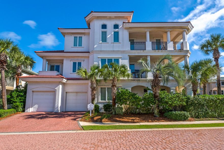 Welcome to ''Vita La Bella'' One of Destiny By The Sea's Most Beautiful homes! Nestled on one of the largest corner lots, the palm trees welcome you and introduce you to the private pool and outdoor entertaining space. The bottom floor has two guest bedrooms, a kitchenette and an additional living space.  This is a great space for kids to have their own area. Working your way the second floor is the main floor of the house which features the the spacious kitchen, living room and a dining room table to host a group. Enjoy this area as the main entertaining space but also the incredible wrap around porch allows the entertaining to continue outdoors. Two master suites are on the third floor and each  feature their own private bathroom. The main master suite has a relaxing sitting area and wet bar for your enjoyment. The balcony on the third floor allow you to take in the breathtaking views and allow you to reflect on all the beauty. The private beach access is directly across the street which is allows you to be on the sugary sand beaches in minutes. Also take advantage of the community pool and hot tub after a fun filled day at the beach. Start living your dream today! Call for your private showing today.