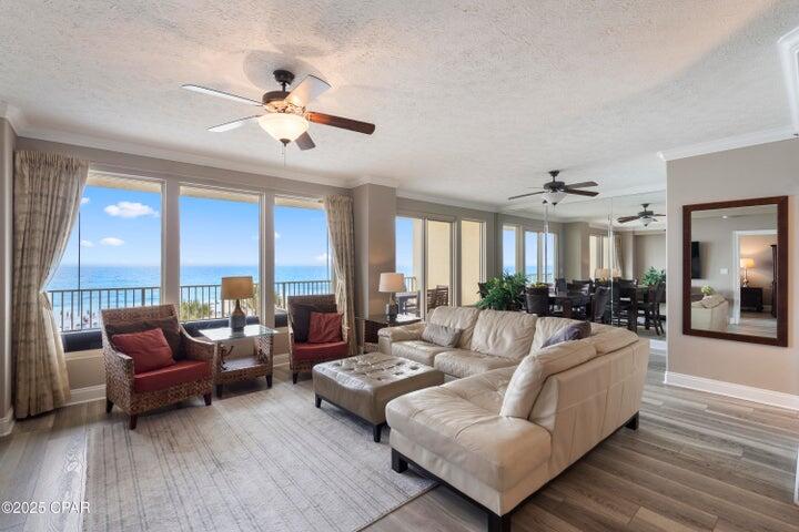 Welcome to Gulfcrest Unit 302--the ultimate beachfront escape you've been dreaming of. This oversized 2-bedroom plus bunk, 2-bath Gulf-front condo offers one of the most desirable and functional floorplans on the beach. Perfectly situated on the third floor, unit 302 delivers sweeping views of the emerald Gulf waters, the sugar-white sandy beach, and stunning sunsets--all views available from the oversized balcony, living room, dining area, kitchen, and master suite. Inside, you'll find a bright, open layout featuring 9-foot ceilings, expansive glass sliders, and a refined coastal-chic design that creates the relaxed feel of a beach house with the low-maintenance ease of condo living.