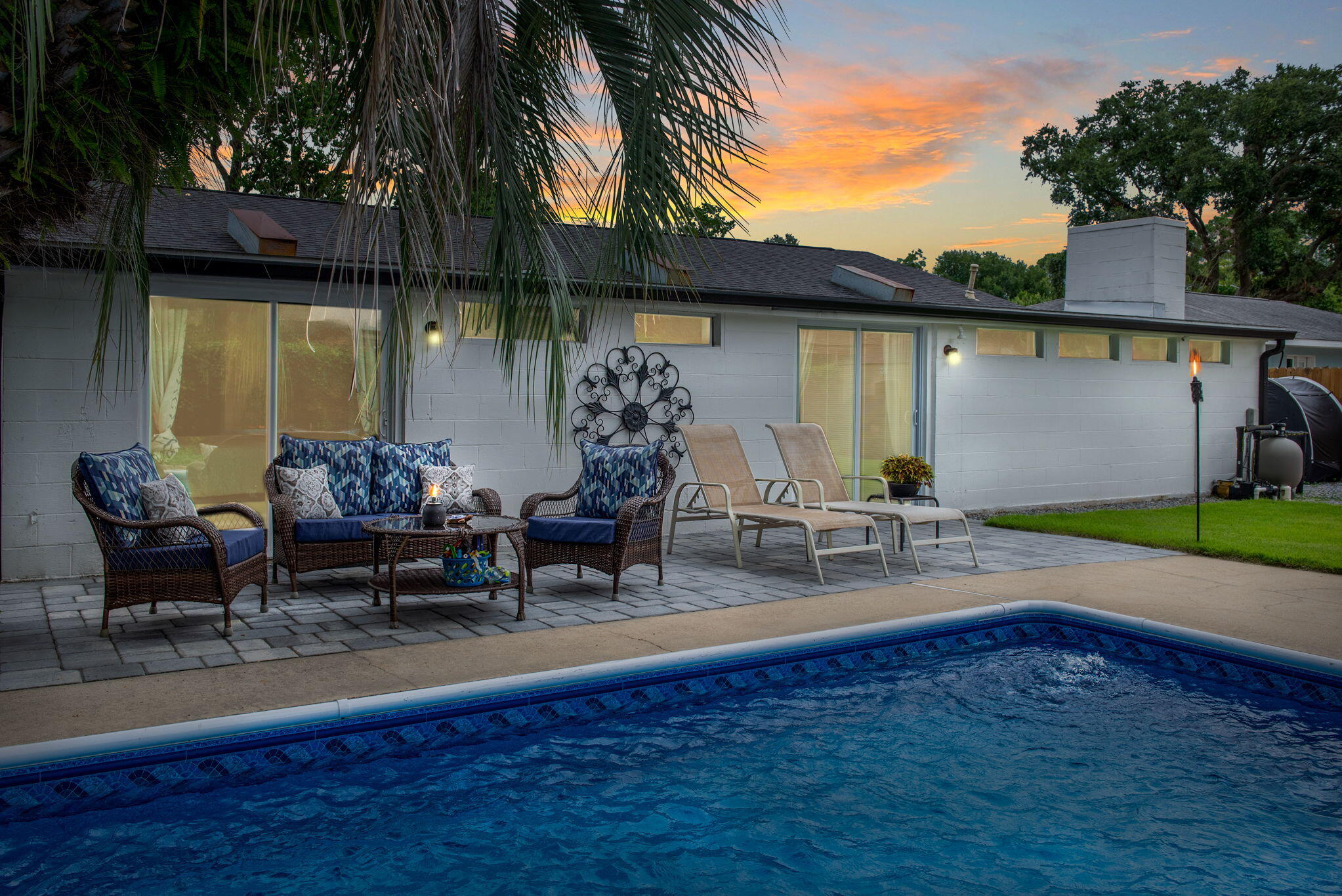 RENOVATED home with a POOL and minutes to Eglin, Hurlburt, or the BEACH! 2022 ALL NEW renovations include ROOF, HVAC, TANKLESS GAS WATER HEATER, ELECTRICAL WIRING/PANELS/FIXTURES, PLUMBING, WINDOWS, DOORS & MORE! You are going to love living the Florida lifestyle in this home with the NEWLY added PAVER PATIO, lush green grass and inviting IN-GROUND POOL! The LINER AND PUMP were replaced in 2022 as well! FULL kitchen & bath remodels were completed incl. appliances, cabinets, vanities, fixtures & counters! The sellers also recently added rain GUTTERS to the front & back of the home! Inside has tons of space: DINING ROOM or OFFICE, LIVING ROOM, & a MUDROOM. Entertain by the pool and then move inside to the large DEN or FAMILY ROOM featuring a brick FIREPLACE and a BAR for entertaining!