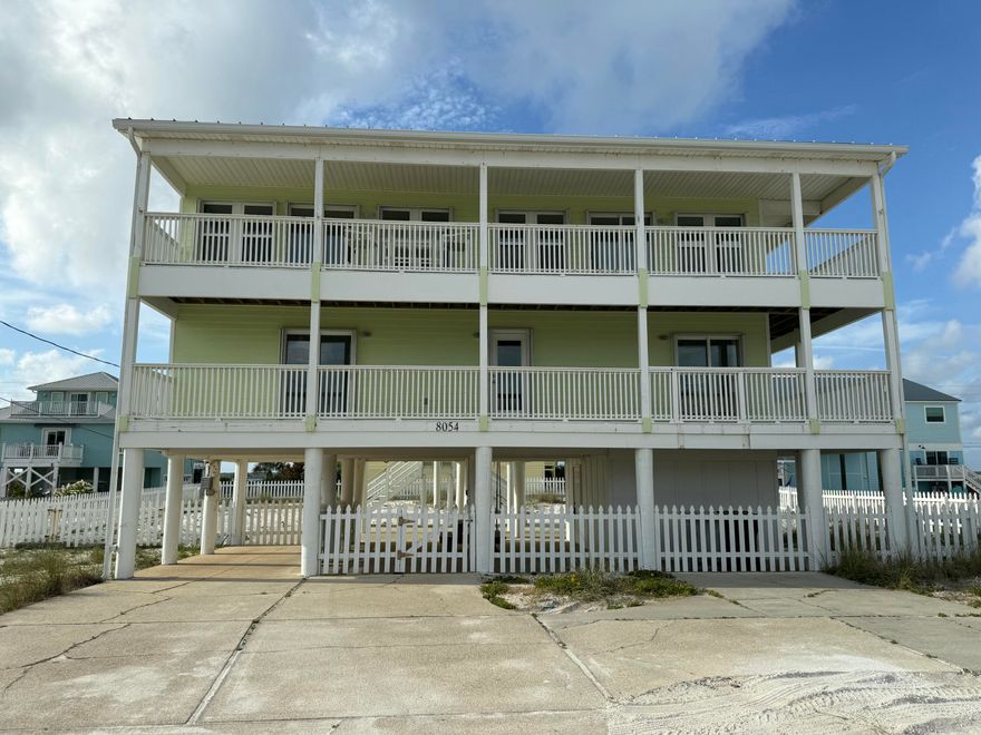 Rare opportunity! This Navarre Beach home offers not only stunning Gulf views but also the chance to assume an incredible VA loan with a 2.375% interest rate (available to qualified buyers). Enjoy island living with no HOA, direct beach access, and the potential for significant monthly savings compared to today's rates.Located directly across the street from the Gulf of Mexico, this unique home captures water views from nearly every room and boasts two spacious decks that span the entire length of the house.The main living area is thoughtfully positioned on the second floor to maximize the breathtaking Gulf and Sound views. Bright and airy, the open layout features a large kitchen with Corian countertops, abundant cabinetry, a breakfast bar, and a cozy dining nook. The living room is surrounded by windows and two sliding glass doors that lead to a covered Gulf-side balcony  the perfect spot to enjoy your morning coffee or evening sunsets.

On the main floor, a wide foyer welcomes you, flanked by two spacious bedrooms separated by a flexible bunk room  ideal for extra guests, an office, or creative space. Both bedrooms offer sliding glass doors leading to the Gulf-facing deck. The primary suite includes a walk-in closet and a private bath with a separate shower, while the guest bedroom is conveniently located next to a full guest bath.

Other highlights include a laundry room on the main level, plenty of storage space, and a prime location just steps from the white sands and emerald waters of Navarre Beach.

Whether you're seeking a primary residence, second home, or vacation rental investment, this property delivers the best coastal living without an HOA's restrictions.

Don't miss your chance to own a piece of paradise  and an unbeatable 2.375% financing opportunity!