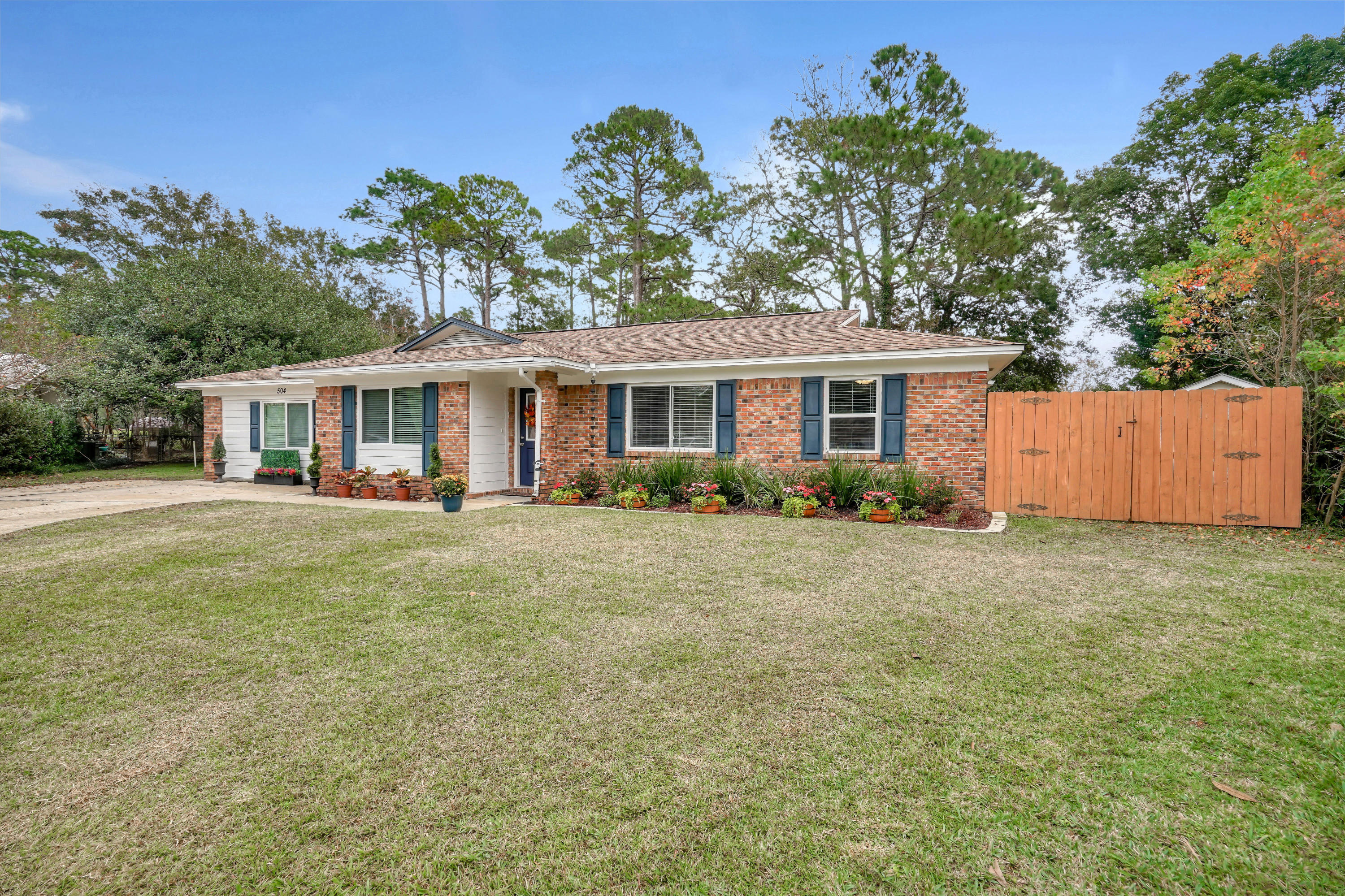 Fully renovated 4 bedroom/3 bath Niceville home with two master suites for $335K! Includes an open floor plan and large yard with privacy fence and two sheds. The spa-inspired master bath boasts a double vanity with granite, oversized walk-in shower, large window for tons of natural light, and extra spacious walk-in closet. 2nd Master is nearly 250 sq ft (18.5x13.5) with private full bath and walk-in closet--could also serve as a large game room. Plank tile in all common areas with carpet in bedrooms. Brick and cement fiberboard exterior! Fresh exterior paint.