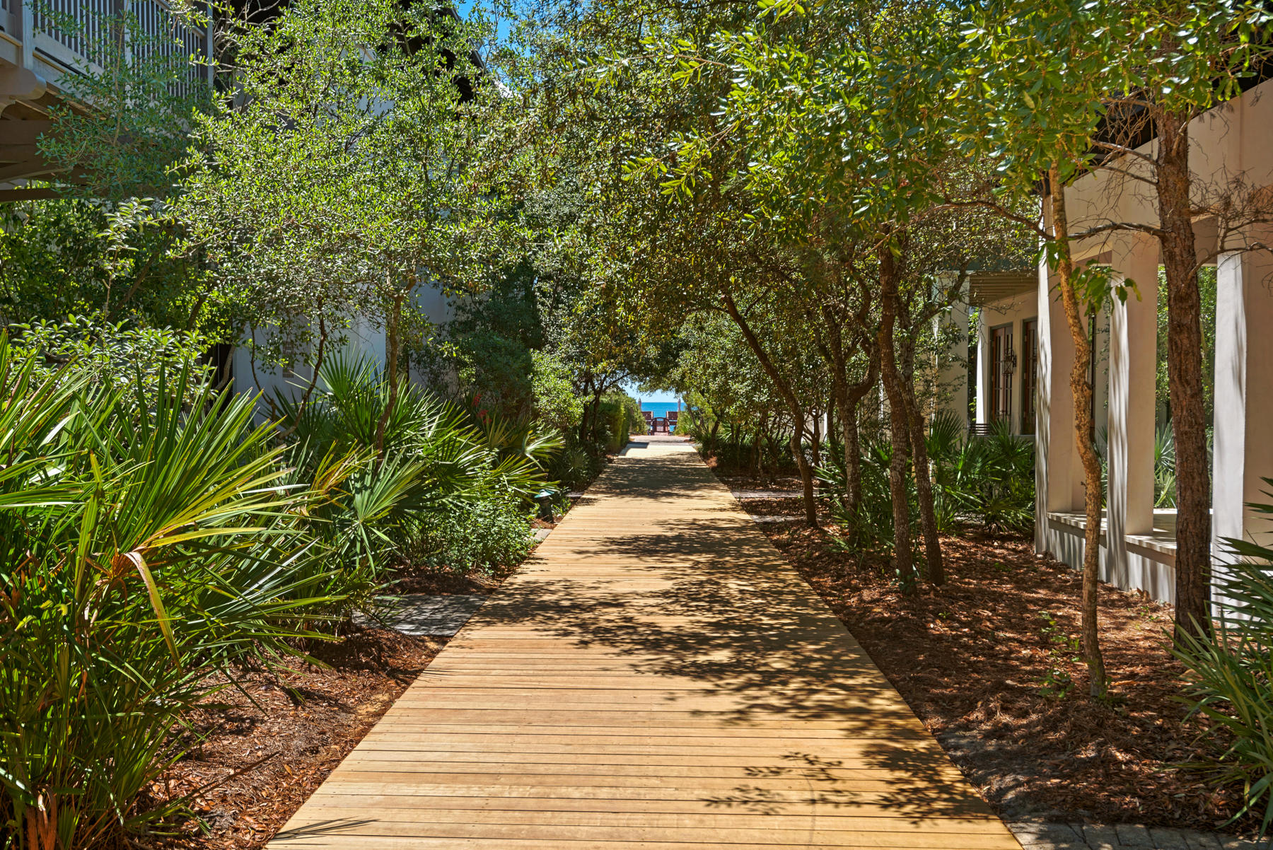 Like its namesake tropical drink, Mai-Tai's Cottage represents Fun in the Sun! So, if you want a casual beach retreat steps from the Beach and right off the boardwalk, this is your perfect get-a-way. Level 1 welcomes you into an open foyer with access to a Guest bedroom and separate entertainment/media room which flows out to a large screened porch and private courtyard with fountain.As you climb the stairs, Level 2 host the main living quarters. Its gourmet kitchen, with Viking appliances and large granite counter, make the perfect setting for casual dining. Then gather with family and friends in an inviting living room or thru French doors to an oversized balcony.Level 3 yields a Master Suite. Carriage House is an enchanting retreat with full Kitchen, Living, Bath, Bunks and Loft.