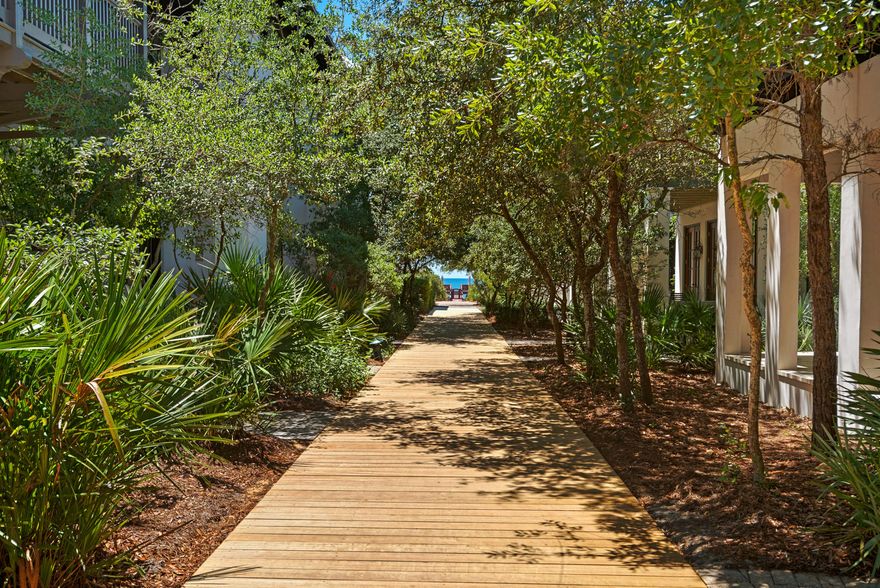 Like its namesake tropical drink, Mai-Tai's Cottage represents Fun in the Sun! So, if you want a casual beach retreat steps from the Beach and right off the boardwalk, this is your perfect get-a-way. Level 1 welcomes you into an open foyer with access to a Guest bedroom and separate entertainment/media room which flows out to a large screened porch and private courtyard with fountain.As you climb the stairs, Level 2 host the main living quarters. Its gourmet kitchen, with Viking appliances and large granite counter, make the perfect setting for casual dining. Then gather with family and friends in an inviting living room or thru French doors to an oversized balcony.Level 3 yields a Master Suite. Carriage House is an enchanting retreat with full Kitchen, Living, Bath, Bunks and Loft.