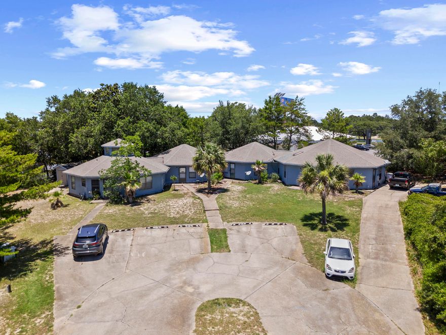 Income-producing 4-plex near Emerald Coast beaches. Property includes one 3BR unit and three 2BR units. Three units are currently tenant-occupied. Located in the College De Sec area with convenient access to beaches, shopping, dining, and major roadways. Buyer to verify all information. Excellent opportunity for investors--schedule a showing today.