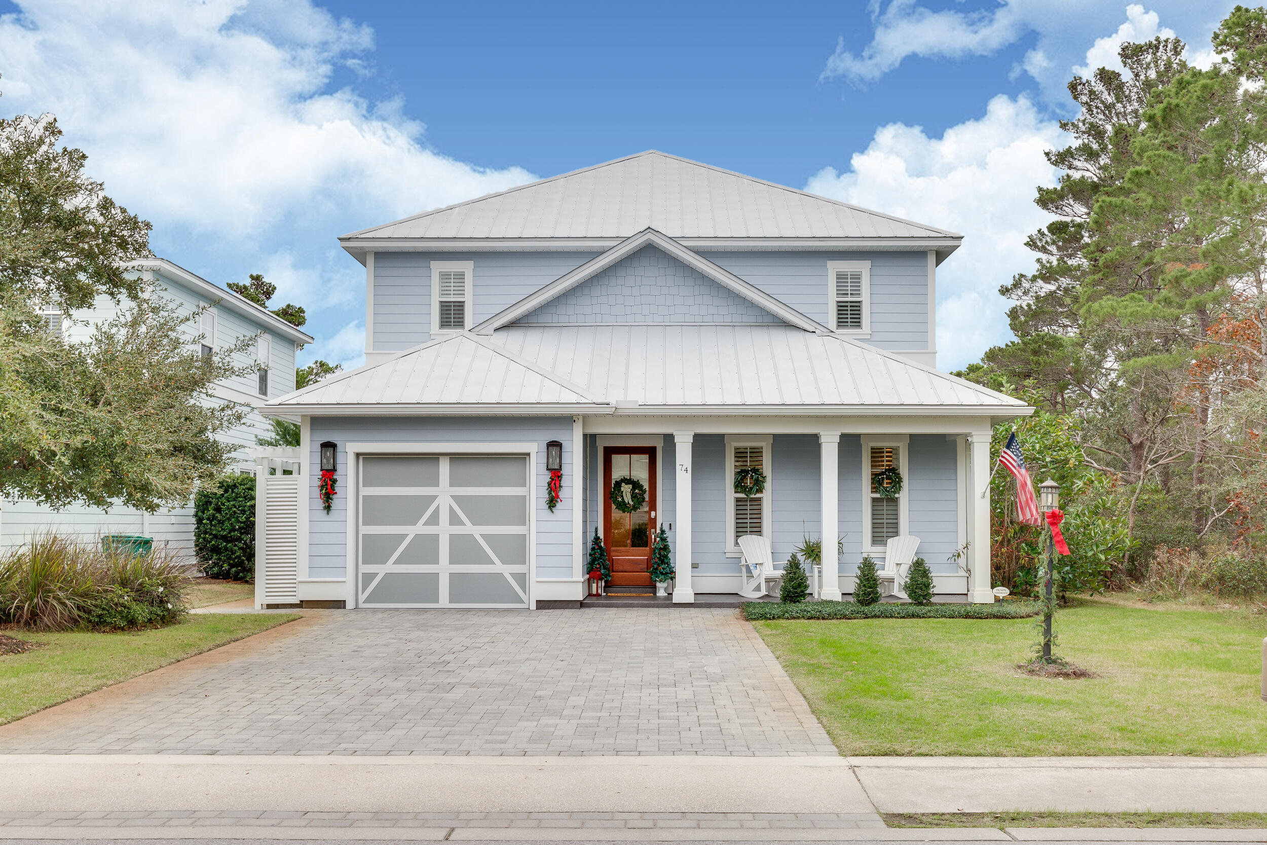 Homes in Gulf Place Retreat do not come on the market often... don't let this one slip past you! Great location - less than 1/4 mile from the beach and Gulf Place. This home has been meticulously maintained, never rented, and full of upgrades.  Relax on the porch swing & take in the beautiful backyard and private pool. This homesite is perfectly situated next to AND backing up to a wooded preserve for the utmost privacy.  This beautiful home has all you need- spacious, bright living room with pocket door that completely opens the space to the backyard oasis. Dining area is large enough to fit all your guests for a feast. Kitchen features wood-stained cabinets, leathered granite countertops, subway tile backsplash, new refrigerator with dual ice makers & gas range with drawer microwave.