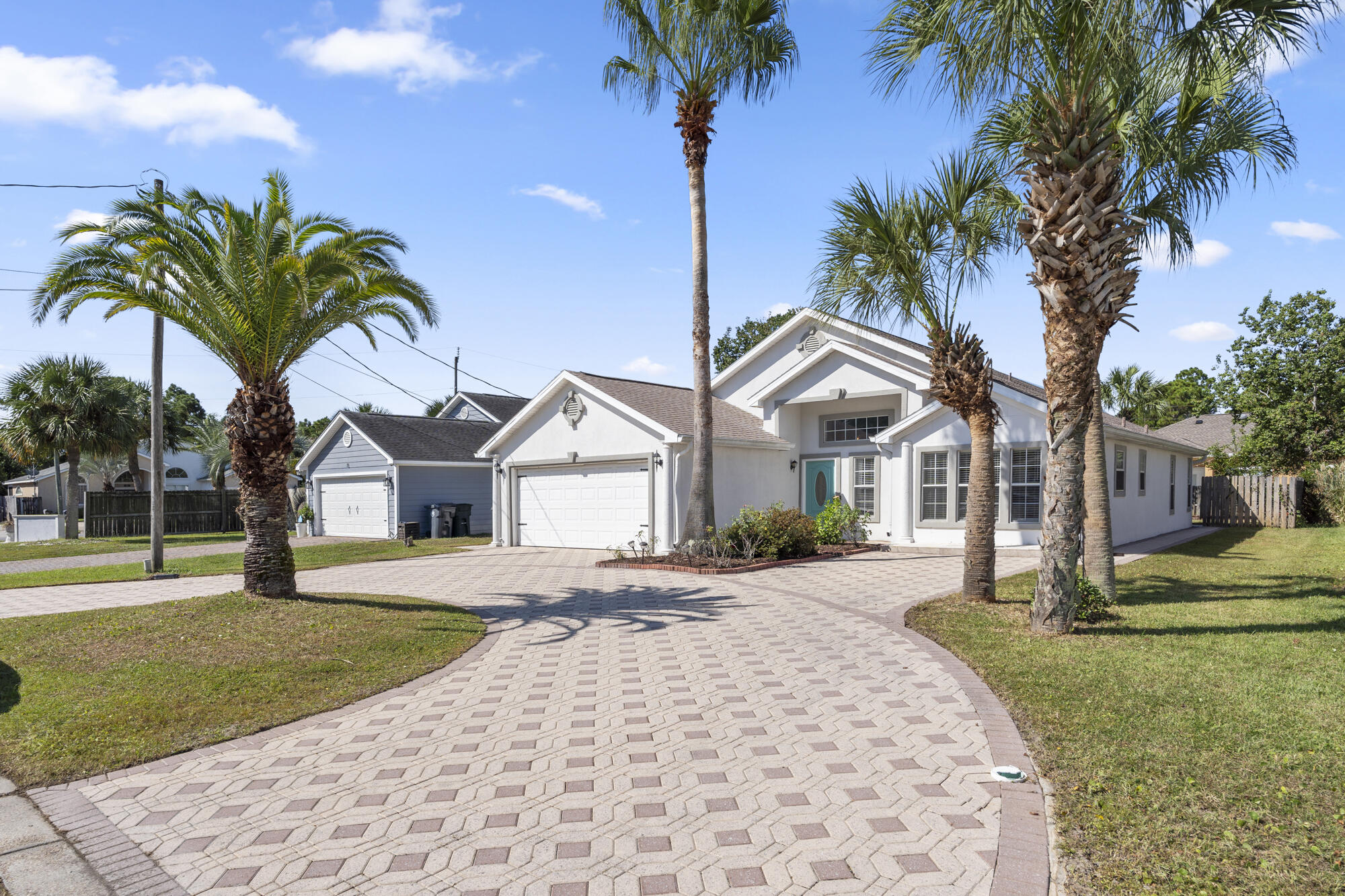Featuring a community pool with LOW hoa, an extended luxury paver driveway and beautiful manicured palm trees as you enter this charming residence. You'll notice a 2022 roof, high ceilings, tons of natural lightning and a large living area. The kitchen offers granite countertops with tons of space and stainless steel appliances. The gutters, pavers on the side of the home and lush outdoor areas enhances the utility of the home. The split floor plan allows for ultimate privacy to your master bedroom that has access to the screen porch, large dual vanity sinks and walk in closets. The master Bathroom is so big, that it allows for a full size tub and shower combo! Whether you are looking for a primary home or second home close to the beach, this stunning property has it all.