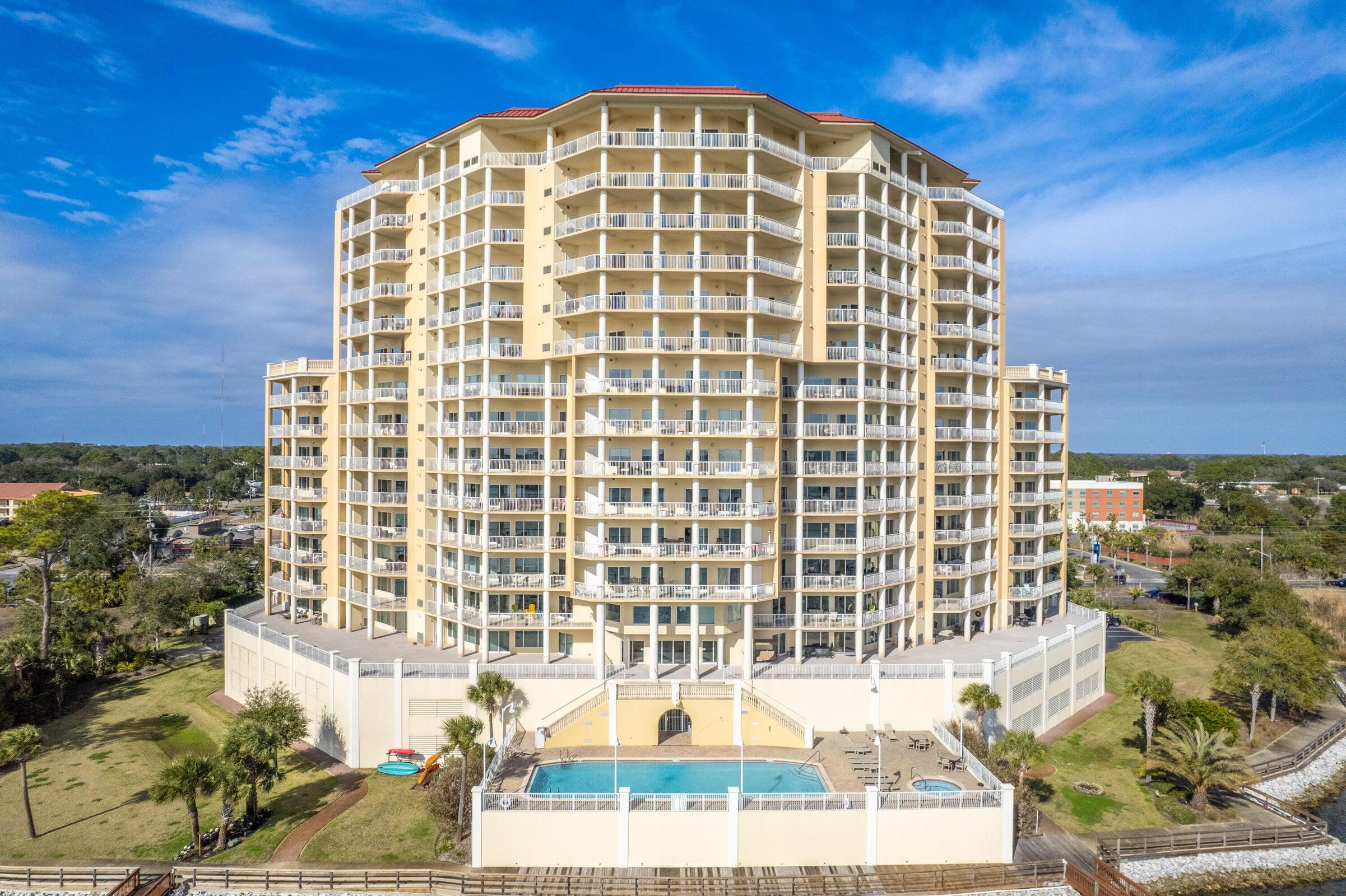 This BEAUTIFUL WATERFRONT condo is the perfect place to relax & enjoy the UNSURPASSED VIEWS of the INTERCOASTAL WATERWAY & GULF OF MEXICO! This unit has 2 BALCONIES w/560SF of ADDITIONAL LIVING SPACE that wrap around the unit and is accessible from both the Living Area & Master Bedroom to easily enjoy the beautiful SUNRISE each Morning. This 5th Floor END UNIT features an OPEN FLOOR PLAN w/spacious living & dining areas that have TILE PLANK FLOORS and a Gourmet Kitchen w/GRANITE tops & CHERRY WOOD CABINETS. Additionally, this unit also has 2 SPACES in the COVERED PARKING GARAGE&  a STORAGE UNIT. Presidio complex has a POOL, HOT TUB, &  FITNESS CENTER & is just minutes from the beach, restaurants, shopping, and entertainment. FWB  Yacht Basin is next door & covered slips w/lift available!