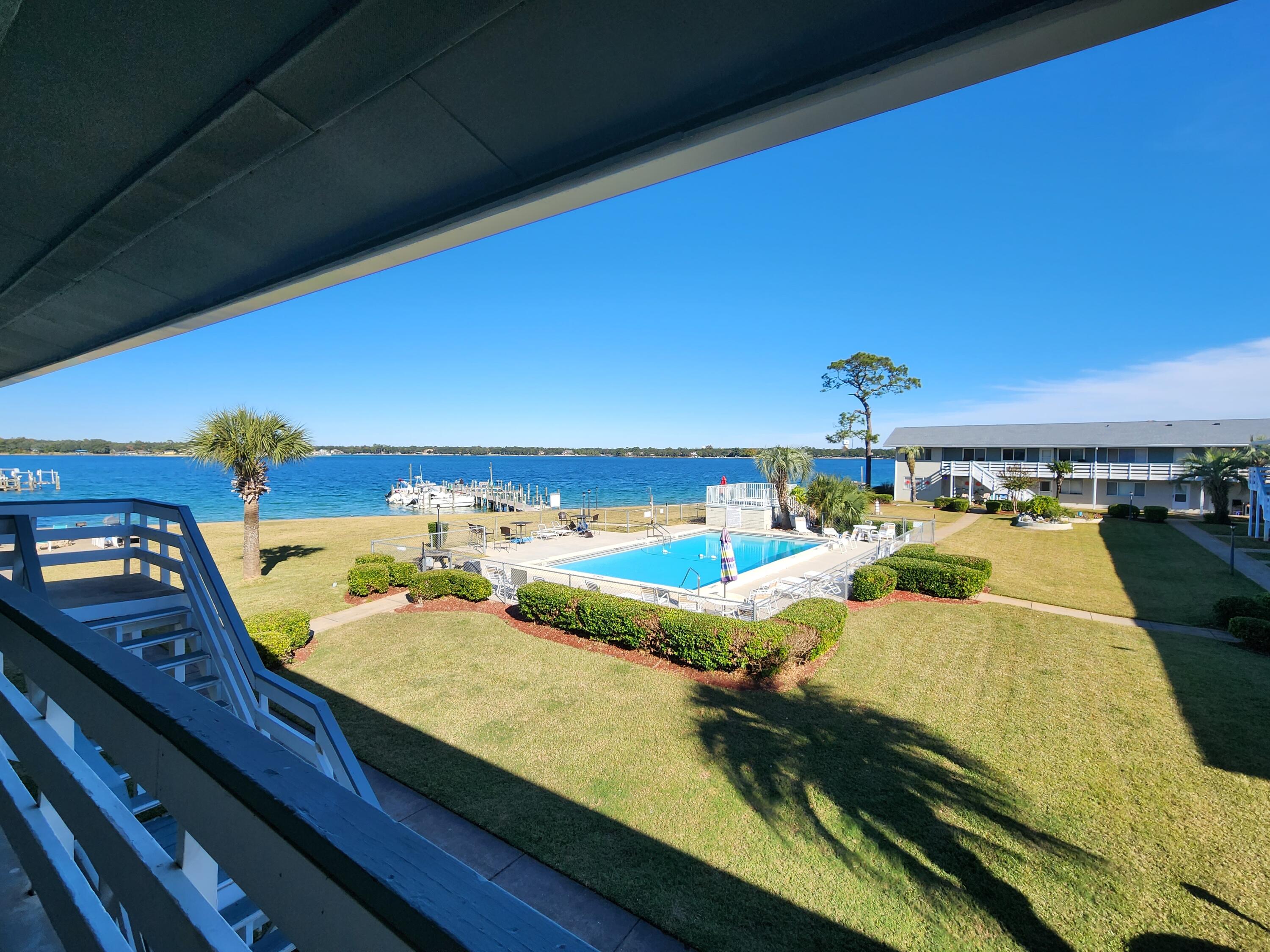 Would you like to walk out your front door to waterfront paradise? Walk down to the dock to fish? Hop in your boat and go for a cruise? THIS is the condo for you! Welcome to Bayview Waters tucked in North of Eglin Pkwy. They front the bayou that connects directly to Choctawhatchee Bay. The community has a centrally located pool surrounded by a large grassy yard. There is a dock with multiple boat slips for owners to park their boats.Inside the unit is hardwood flooring throughout minus the kitchen and bathroom which are tiled. From the master bedroom window you will see a perfect view of the waterfront. Large living area with kitchen connected. The condo has been very well kept and ready to move in!