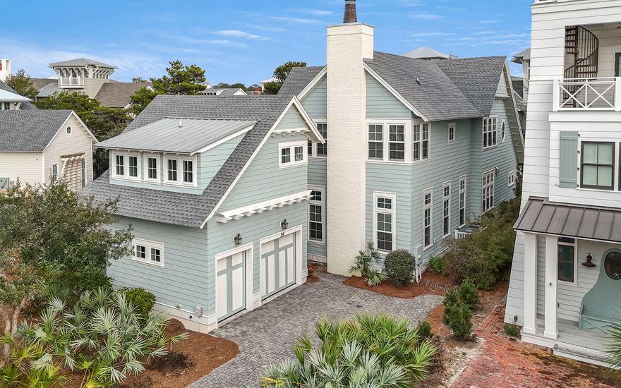 Located within the gated community of Watersound Beach, 34 N Watch Tower Lane offers a seamless blend of modern coastal design and luxurious living. This exquisite five-bedroom, five-and-a-half-bathroom residence, which includes a detached carriage house, is perfect for both relaxation and entertaining.The main home boasts an open-concept layout with expansive living areas and a chef inspired kitchen equipped with top of the line Thermador appliances, marble countertops, and custom cabinetry. A spacious primary suite on the main floor features a spa-like bathroom with a soaking tub, separate shower, and dual vanities. The second floor houses a cozy additional living space and three guest bedrooms, including a bunk room, each with an en-suite or shared bath. The detached carriage house offers added flexibility with a private bedroom, full bathroom, kitchenette, and separate living areaideal for guests or multi-generational living.

Outdoor living is enhanced by a private courtyard, sun deck, and covered porch area, offering space for relaxing or entertaining. 

34 N Watch Tower Lane is a rare gem, offering an opportunity to own a piece of this coveted coastal enclave. Inquire today to schedule a private showing.
