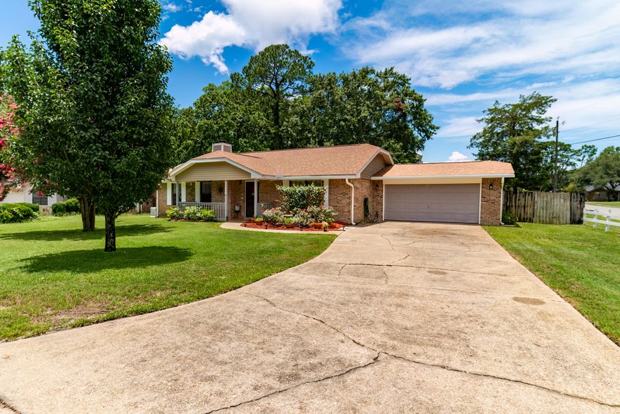 This charming home is in the heart of Niceville, in a highly desirable location, double-sized lot, surrounded by mature landscaping. Solid brick home, featuring 3 bedrooms, 2 baths, bonus room, large great room with gas fireplace, and a newly renovated kitchen with large island, under cabinet lighting, stainless appliances, and new LVP floors.  Step outside to your private saltwater pool surrounded by well-kept landscaping and koi pond. The back patio is covered by a remote-controlled, retractable SunSetter equipped with wind sensors for those warm days.  The home boasts a 25x25 Boat/RV carport with gate access on 20th Street.  The home has a WHOLE house Generac generator (22W) for your peace of mind.  Roof 2020.  New New carpet. Home warranty provided to new buyers.