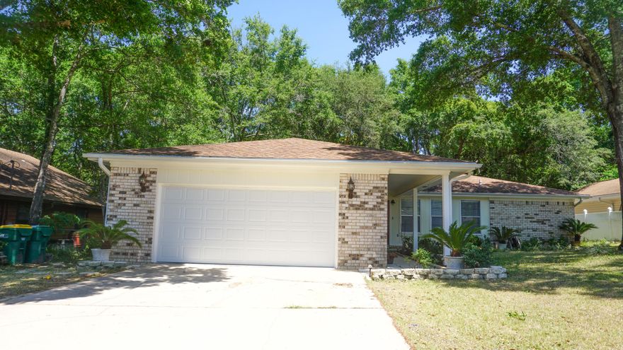 This is an amazing split floor plan home in heart of Niceville. Walk in to the large living area with vaulted ceilings and fireplace. To the right is the kitchen and master bedroom with large closet and bath. To the left are other bedrooms with Jack and Jill bath. Great screened in back patio with a hot tub that conveys in AS IS condition.