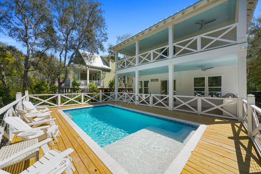 Just a short distance to the sand, this spacious 4 bedroom, 3 bath home is located less than a quarter mile from the beach in Seagrove. Built in late 2023, the home features durable LVP flooring throughout, a smart layout, and plenty of natural light.The open first floor includes a large living area, generous dining space, and a well-appointed kitchen with modern gas appliances, great storage, and plenty of counter space for cooking or entertaining. A guest bedroom and full bath on the main level offer added flexibility for hosting.Upstairs, the primary suite includes a walk-in shower and private balcony that stretches the length of the home. Across the hall are two more guest rooms, one with two full beds, the other with twin-over-twin bunks along with a shared full bath. Out back, you'll find a heated pool added in 2024, a built-in gas grill, and outdoor shower and plenty of deck space to relax. The home also comes with a 2023 electric 6-seater golf cart, perfect for exploring Seagrove and nearby spots along 30A.