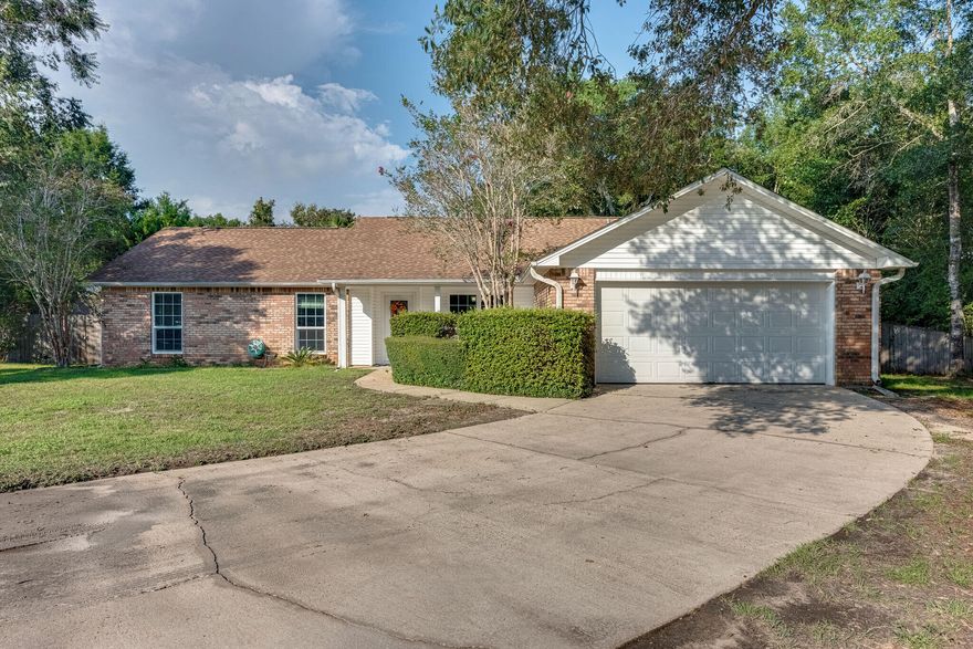 Stunning all brick home located in Robledal Estates, a beautiful neighborhood in Navarre with overhanging oak trees and no HOA. Enjoy the option to access the private neighborhood boat launch, firepit and dog park. Situated on a quiet cul-de-sac, this home has a large multi-car driveway, privacy fenced backyard and room to add boat parking. High ceilings, wood burning fireplace and plenty of natural light make this the cozy home that you have been looking for. Master suite offers a dual sink vanity and a dressing area, his and her closets and wood-look flooring. The additional 3 generously sized bedrooms offer plenty of space for all your needs where the 4th bedroom can easily be used as an office or flex space.