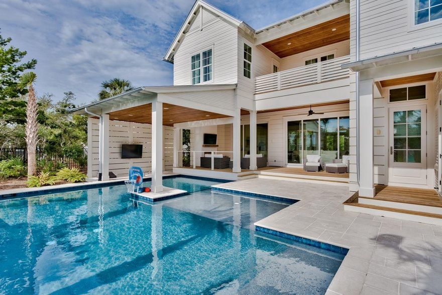 Ideally located in Blue Mountain Beach, this recently constructed home is perfect as a vacation rental or as a primary residence. Outdoor living is exemplified with an oversized private pool featuring a swim up bar, sun shelf, and cabana, as well as an expansive covered patio with outdoor fireplace, TV, grill, ice maker, fridge and multiple seating areas. Inside, the main floor is highlighted by the gourmet kitchen and spacious living room, which features 12 foot ceilings ,shiplap, and rustic beams. The spacious bedrooms each feature their own en suite bathrooms, as well as sizable closet space.