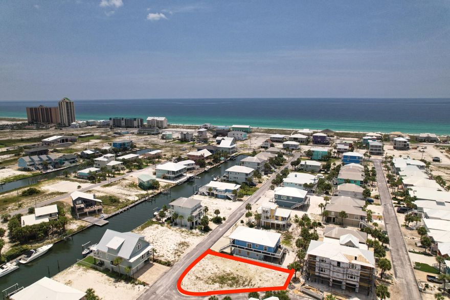 Build your dream home on this vacant corner lot in the popular subdivision of Homeport.  You are 20' from accessing the private beach on the sound where you can go fishing, swimming, paddle boarding or kayaking.  There is a community pool with bathrooms and picnic tables.  Short golf cart ride to the public beach access on the Gulf of Mexico.  Building design options could definitely include views of the sound to watch the sunset.  2021 Survey and a rendering of where the house can be built is available. Don't miss out on one of the few opportunities left to build on Navarre Beach!