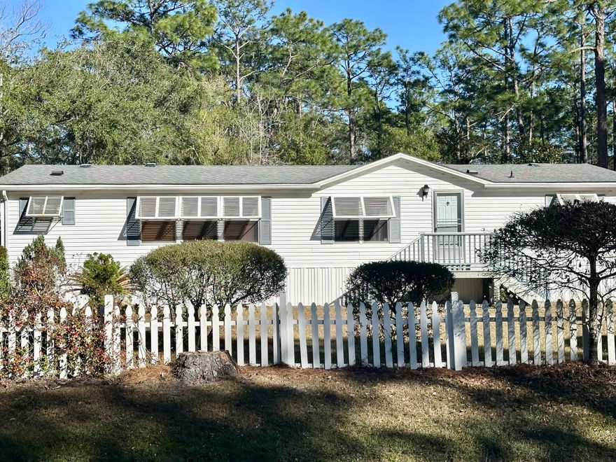 Welcome to this charming 3-bedroom, 2-bathroom mobile home, nestled on a spacious 1-acre lot. This property offers an open floor plan, perfect for easy living, and a lovely screened porch where you can relax and enjoy the outdoors. Located less than .5 miles from the bay and just minutes from Hwy 30A, Grayton Beach, WaterColor, Seaside, and the Gulf of Mexico, it provides both convenience and coastal charm. The home is ideal as a rental property or as a cozy residence while you plan and build your dream home. With plenty of room for expansion, there's ample space to add a large home, garage, pool, garden, or whatever your heart desires. The property is also conveniently close to schools, grocery stores, a hospital, shopping, and dining options. Don't miss out on this must-see opportunity!