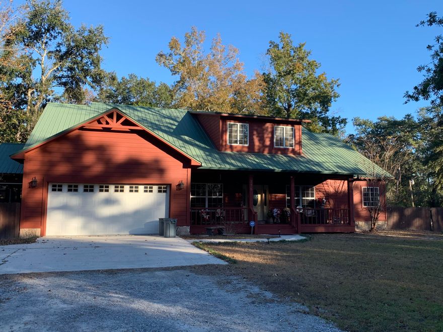 Please note** This listing also contains parcel# 02-2S-19-24000-034-0020 and parcel# 02-2S-19-24131-000-0020 along with the parcel listed.  Beautiful log siding home sitting on just over one acre.  No details were missed when building this home.  There is cedar and pine throughout with a log staircase, a gas fireplace in the living area and electric fireplace in the bedroom. Plenty of closet space throughout the home.  The master bathroom has a huge walk-in closet, a shoe closet, plus a linen closet.  The kitchen features a breakfast area, 2 ovens, custom hickory cabinets, and island. Enjoy mornings or afternoons on the side screened porch, front porch, or back porch.  This property also features an in-ground pool with a privacy fence, a 1,728 sq ft. workshop/garage, concrete driveway and walkway, and another drive that is gravel.  All information including room dimensions need to be verified by the buyer.