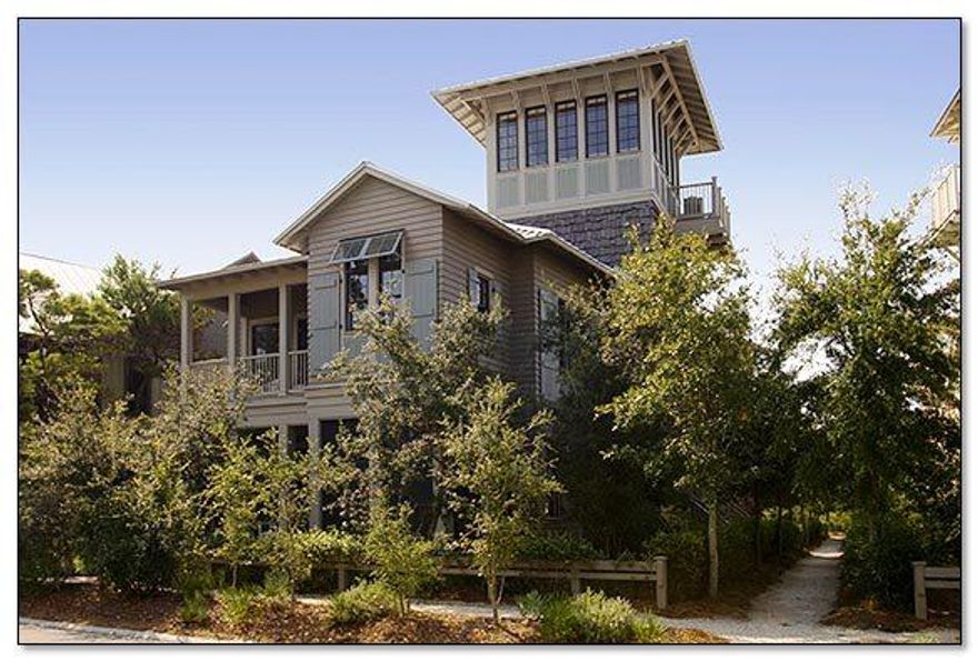 This distinctive Florida Beach house designed by Tom Christ is located in WaterColor's Premier Park District and affords many upgraded custom features. The first level delivers two spacious guest suites which include their very own private baths & walk in closets. One of the suites offers a discreet sleeping porch. The first level also provides a laundry/mudroom, private screened logia complete with cabana bath and a two-car garage. The spacious second level offers an open concept kitchen, dining and living area, a cozy fireplace and grand piano vestibule ideal for entertaining friends and family. Cherry floors and vaulted ceilings with heavy beams add to the ambiance of this home.