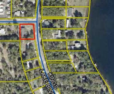 Spacious 3-bedroom, 2-bath mobile home offering 2,280 sq ft of potential on a fenced 0.40-acre corner lot with a waterview of Kings Lake. Featuring a large great room, existing utilities, and plenty of room to reimagine or rebuild. The home needs significant repairs and may be best suited for renovation or replacement--perfect for investors or buyers seeking a project in a desirable area just outside of town. Cash or owner financing terms available--bring your vision and make this property shine!