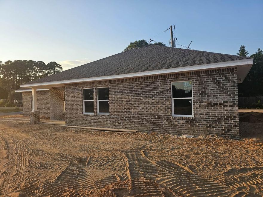 NEW CONSTRUCTION by Hi Lite Homes in Villa Tasso, one of the fastest growing communities in the Niceville area!!  This adorable and AFFORDABLE 3 bedroom, 2 bath brick home with a 2-car garage will be ready by the end of October 2025.  The open, split bedroom floorplan is sure to please all buyers and the yard is the perfect size, not too big and not too small.  Interior features include shaker style cabinets, granite counters, stainless appliances, LVP flooring and even blinds for the windows. This home is located on a street with other new homes surrounding with 7 additional new homes built on the same block. Homes in this price range go fast so don't miss your opportunity to make this NEW home your own! (finished pictures are of a similar home built by same builder)