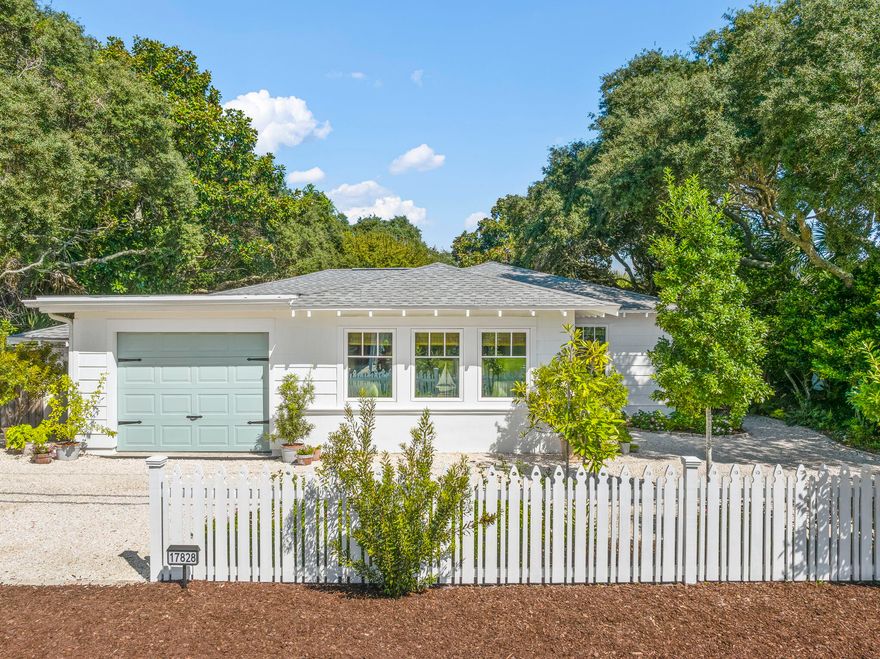 Charming Coastal Cottage just one block from the beach! Completely renovated inside and out, this home offers a new roof with waterproof membrane and hurricane clips, LP SmartSide siding, new impact doors and windows, and an energy-efficient HVAC system, plus fresh interior and exterior paint. Designed by a professional interior designer, it features antique French barn doors, decorative finished concrete floors, and a master suite with a deep soaking tub and private sitting room. Added protection includes hurricane fabric, and all of these upgrades provide a huge insurance discount, currently only $2,400 per year. Sold furnished, the home is turnkey. Landscaped grounds with well water sprinklers lead to a secret garden oasis just steps from the Gulf.