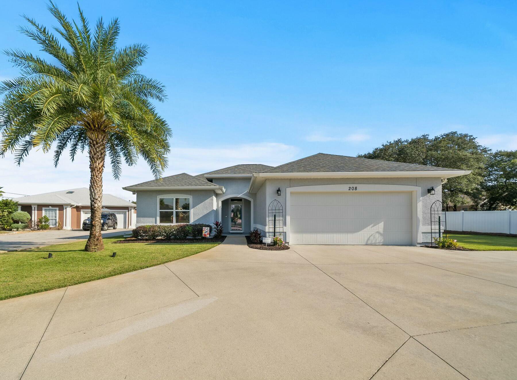 Nestled in the desirable Summerwood community, this beautifully maintained three-bedroom, 2.5-bath home offers an unmatched combination of comfort, privacy and convenience. Located in the heart of Panama City Beach, this property is just 1.5 miles from Pier Park, a short drive to local favorites like Sharky's and Diego's, and minutes from the stunning Gulf Coast beaches. Situated on an oversized lot in a quiet cul-de-sac, this home is perfect for those seeking a primary or secondary residence in a peaceful neighborhood that doesn't allow short-term rentals. The private backyard oasis features an impressive 26x32 saltwater pool with travertine decking, a pool cover and an in-floor cleaning system, all designed to make entertaining and relaxation effortless. The outdoor space also boasts a polywood dining set, weatherproof speakers, a refrigerator and a well-maintained Zoysia grass lawn fed by a private well and sprinkler system. Inside, the spacious family room is the heart of the home, with 18x18 tile floors and built-in bookcases. The master suite, located at the rear of the home for privacy, includes a large walk-in closet, dual vanities and ample room for a king-sized bed. The two guest bedrooms share a full bath, while a convenient half-bath is near the main entry. The two-car garage offers generous storage, including full-sized metal cabinets. Additional features include a storm-secured shed, hurricane windows and shutters and a PVC privacy fence. Summerwood residents also enjoy a community pool and low HOA dues. This home is move-in ready and offers the perfect balance of serene living and proximity to Panama City Beach's best amenities.