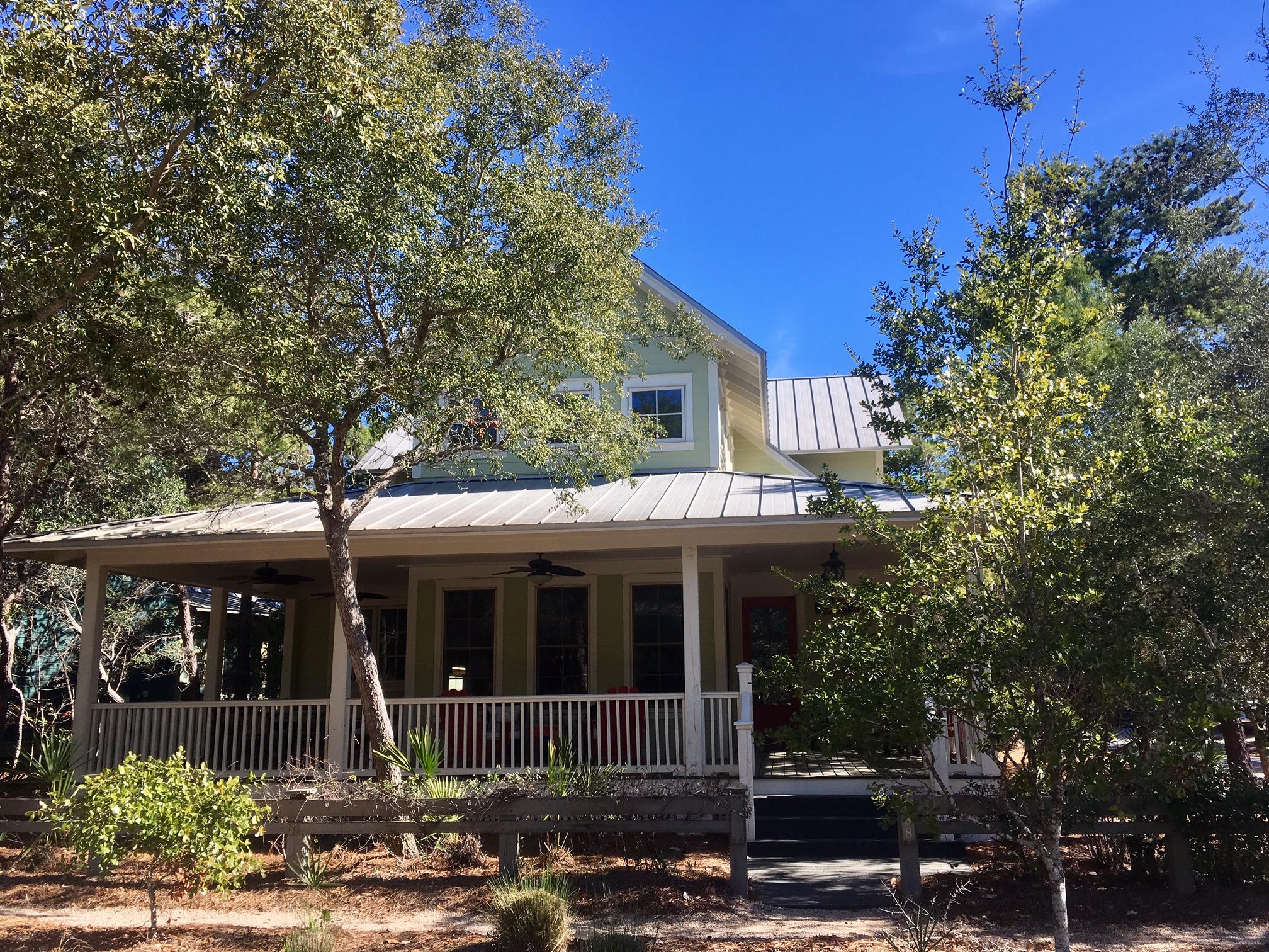 This charming beach home, located in the heart of WaterColor, is situated on a large corner lot and is just a short stroll to the beach, pool and WaterColor's Town Center (featuring restaurants and shops). As you enter the home you are greeted with a beautiful open floor plan featuring numerous windows and a vaulted ceiling that provides tons of natural light. There are two bedrooms on the main level and the Master suite is on the second level. There is also a separate carriage house, located above the 2-car garage, that has a full kitchen and studio bedroom.