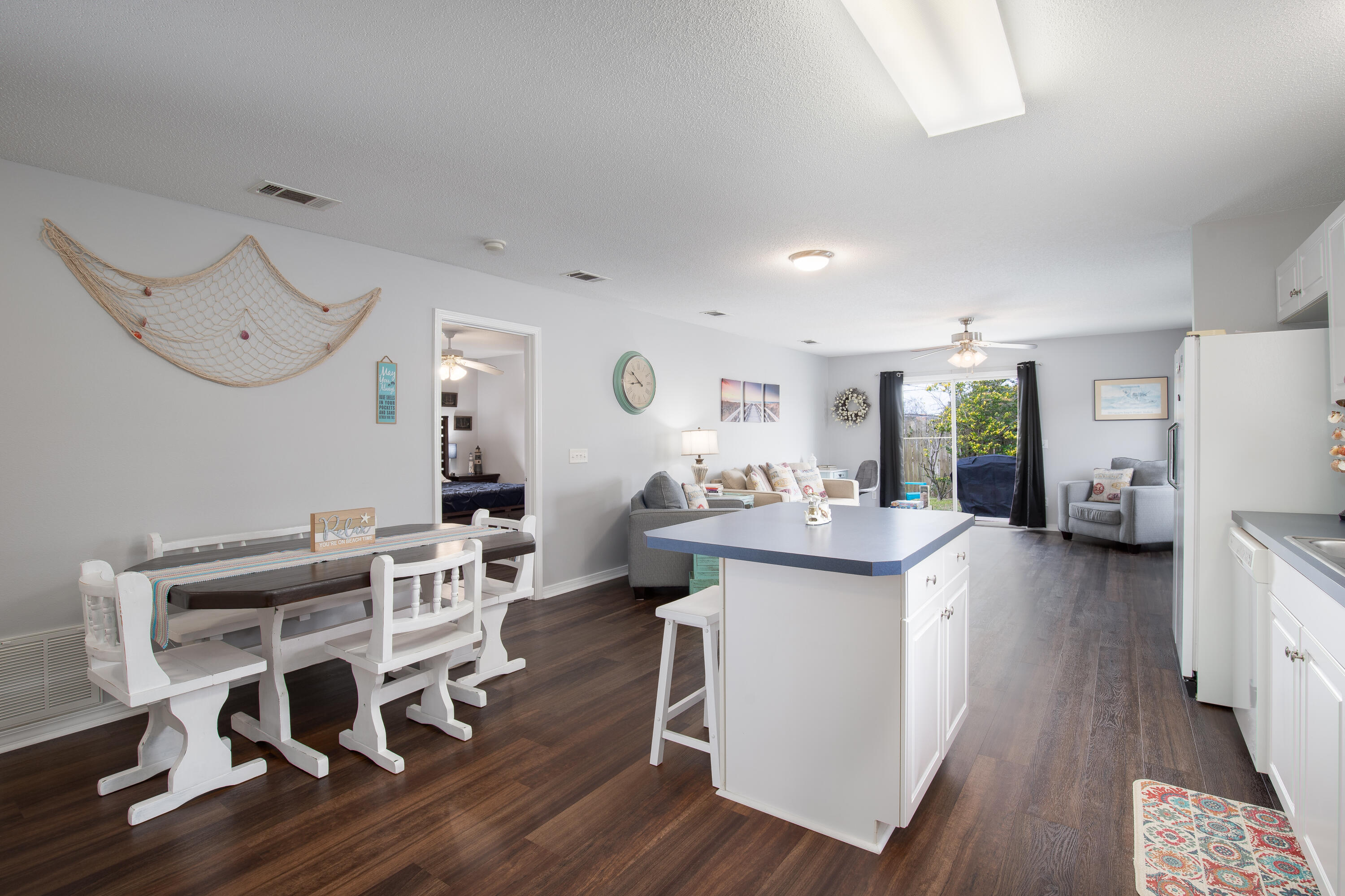 Charming Craftsman-Style Retreat | No HOA | Ideal for Investment or Everyday Living! ROOF 2021 | HVAC 2017 | WH 2019. Step into comfort, character, and convenience with this beautifully maintained 3-bedroom, 2-bath Craftsman-style home, designed with open-concept living in mind. Whether you're looking for a full-time residence, a profitable short-term rental, or a vacation retreat, this property checks every box and best of all, no HOA restrictions. The heart of the home is a spacious, flowing layout that combines the kitchen, dining, and family room, perfect for effortless entertaining or cozy nights in. Durable vinyl plank flooring (installed in 2019) runs throughout, offering both style and low maintenance. The primary suite is a private haven, featuring custom closet built-ins and an en-suite bathroom equipped with a garden tub and shower for your relaxation. Step outside into a fully fenced backyard- ideal for pets, privacy, and outdoor gatherings. A rear gate provides direct access to nearby local amenities, adding unmatched convenience to your lifestyle or rental guests' stay. Call today and ask for your private tour!