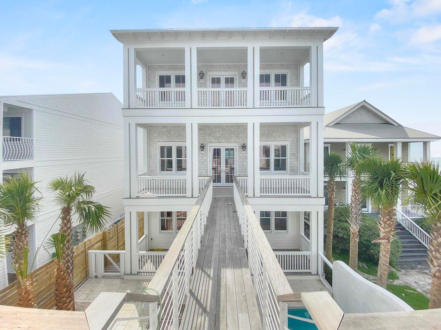 Create a legacy unlike any other where your family can enjoy an unparalleled lifestyle for years to come. Envision an estate where many generations can cherish daily panoramic sunsets & sunsets, beach days filled with sunshine just steps from your front door and a place to relish in the simple pleasures of life. This stunning 30A Gulf-front three-level residence, with a gorgeous main house, guest house, and 2-car garage is the perfect tribute to your family. The property boasts morning sunrises and evening sunsets off the expansive porches affording outdoor living as it was meant to be and is wonderfully suited for entertaining guests or relaxing in the heated pool in the courtyard surrounded by stunning privacy landscaping.