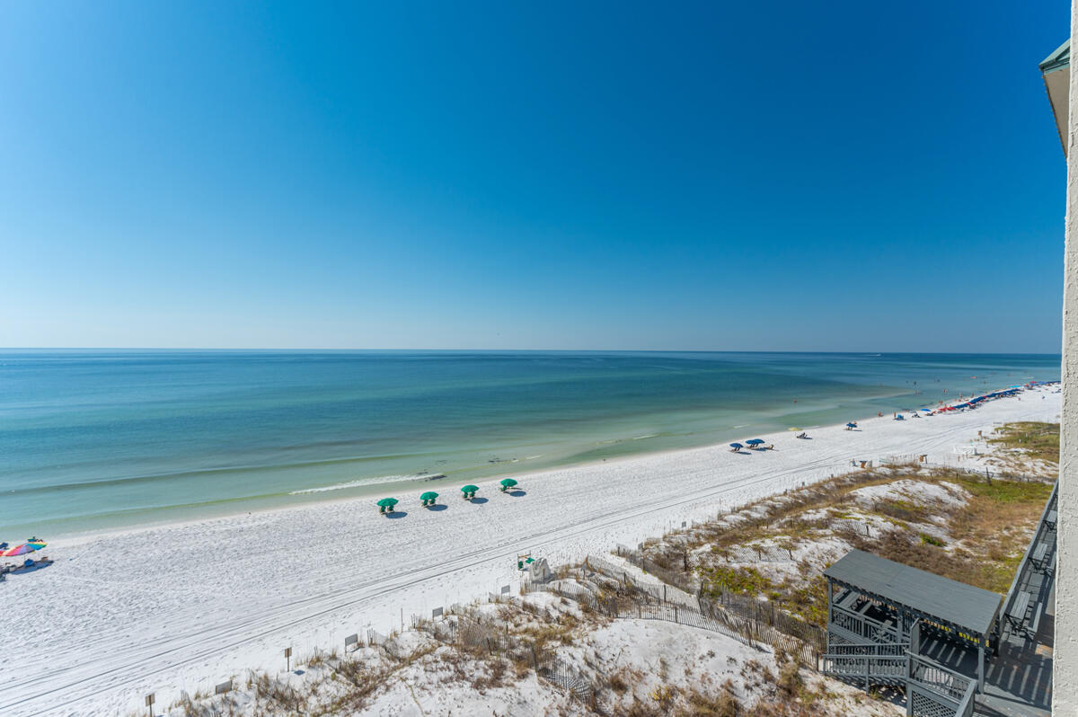 PHENOMENAL GULF VIEWS from Every Room in this 4th Floor, East End Unit. BRAND NEW KITCHEN with NEW Wood Cabinets, NEW Granite Countertops & NEW Appliances. Both Bathrooms have NEW Cabinets & Granite Tops, plus a NEW Shower in Guest Bathroom. New flooring in both Bedrooms- No Carpet in the home. Extensive woodwork with built-in bookshelves, beautiful crown moulding, wet bar plus breakfast bar. Fully Furnished & ready to be your Beach get-a-way or home for permanent living. Compass Rose has completed the Milestone Inspection & Certification. Unit 410 has a 2-car tandem garage, beach level storage unit & extra storage unit. Roof-top Viewing Deck, Beach Level Deck w/shower, Exercise Rm & more! If you want the luxury of a quiet building with no short term rentals, then your Paradise is here!
