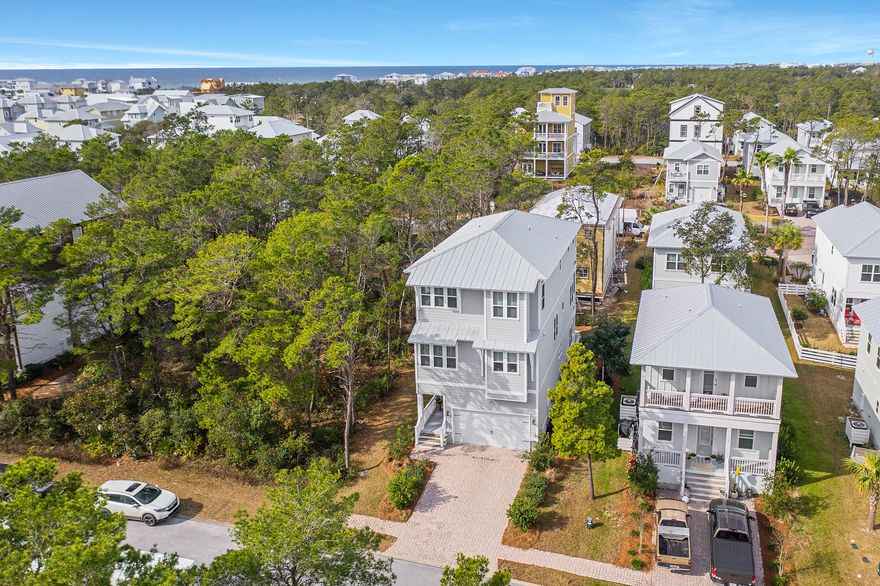 Here is your chance to own in Grande Pointe in Inlet Beach. This home has it all. This 4 bedroom, 3 bathroom home features hardwood flooring throughout, an upgraded kitchen and an elevator to make life easy. The floorplan is perfect. The first floor features a Bedroom/bonus/playroom with full bath.  Going up the 2nd floor you enter into a fantastic open living space with a large living room, dining area and kitchen along with a half bath and laundry for convenience. The 3rd floor features the master and other two bedrooms. Grande Pointe is situated perfectly with community access to Lake Powell and an easy walk or bike/golf cart ride to one of the many Inlet Beach Public beach accesses along with Camp Helen State Park. Just minutes from 30A or the shopping at 30Avenue.