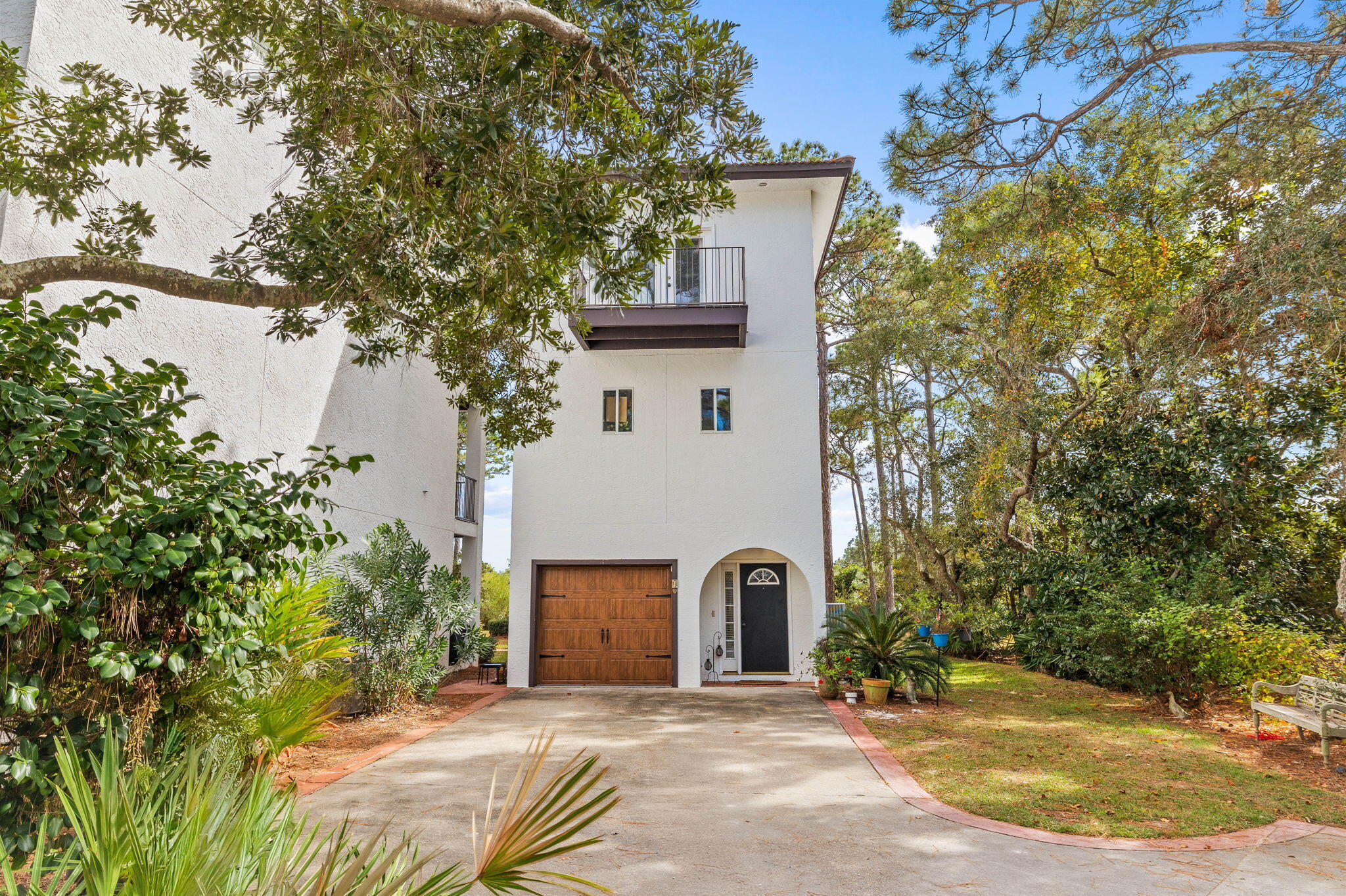 Welcome to this spacious 3-bedroom, 3.5-bath home in the secluded, lakefront Mar-A-Lago community of Seagrove Beach, featuring stunning gulf and coastal dune lake views. Nestled near Eastern Lake, this private Mediterranean-inspired community has only 14 villas centered around Tresca Lake and a nature preserve. Inside, enjoy a first-floor suite with an en-suite bath and terrace, while the main living area on the second floor boasts an open floor plan, high ceilings, hardwood floors, a fireplace, and panoramic lake views from a private deck. The kitchen is beautifully appointed with quartz countertops, ample cabinet space, a breakfast bar, and stainless steel appliances. Upstairs, the main master suite includes a private terrace with breathtaking Gulf views. Located just a 3-minute walk from beach access, this home combines elegance, comfort, and a perfect setting for unforgettable sunsets.