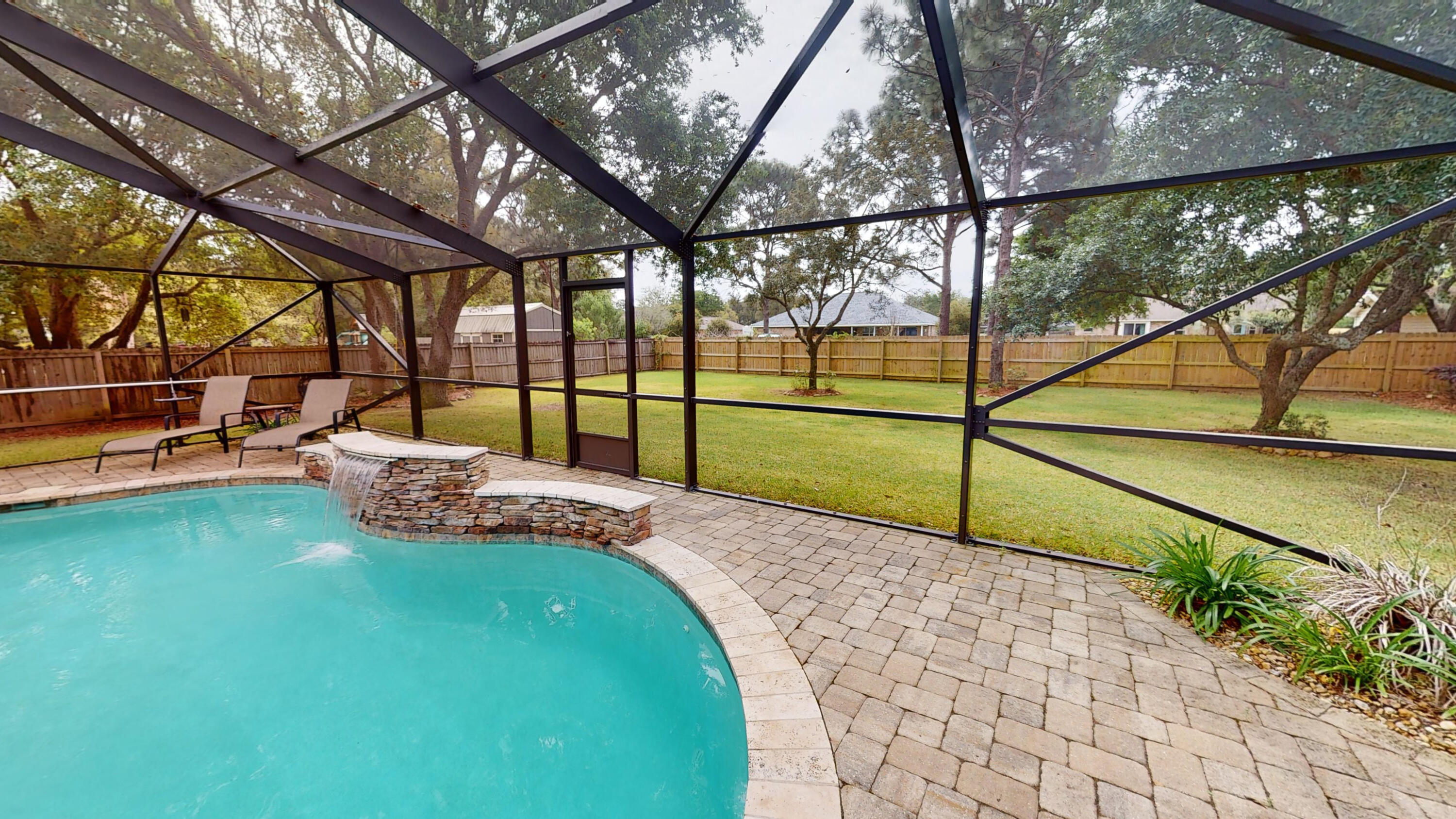 ***ASSUMABLE VA MORTGAGE WITH RATE UNDER 3% FOR QUALIFIED VA BUYER!!!***This large 3 bedroom 2.5 bath welcoming home with a separate office and an enclosed pool sits on a large lot (over half an acre) in Holley by the Sea and comes with all the access to the gym, pools, boat ramp, and so much more!  The large kitchen features granite countertops, stainless steel kitchen appliances including a double oven, stainless steel double bowl kitchen sink with a touch-activated faucet, and a separate pantry.  The spacious master bathroom has a self-standing tub, a large tiled shower complete with an adjustable shower head and body sprays, granite countertops, and a walk-in closet.  Relax in the enclosed pool with water feature, sitting ledge, and paver patio.  A fenced backyard, double gate for