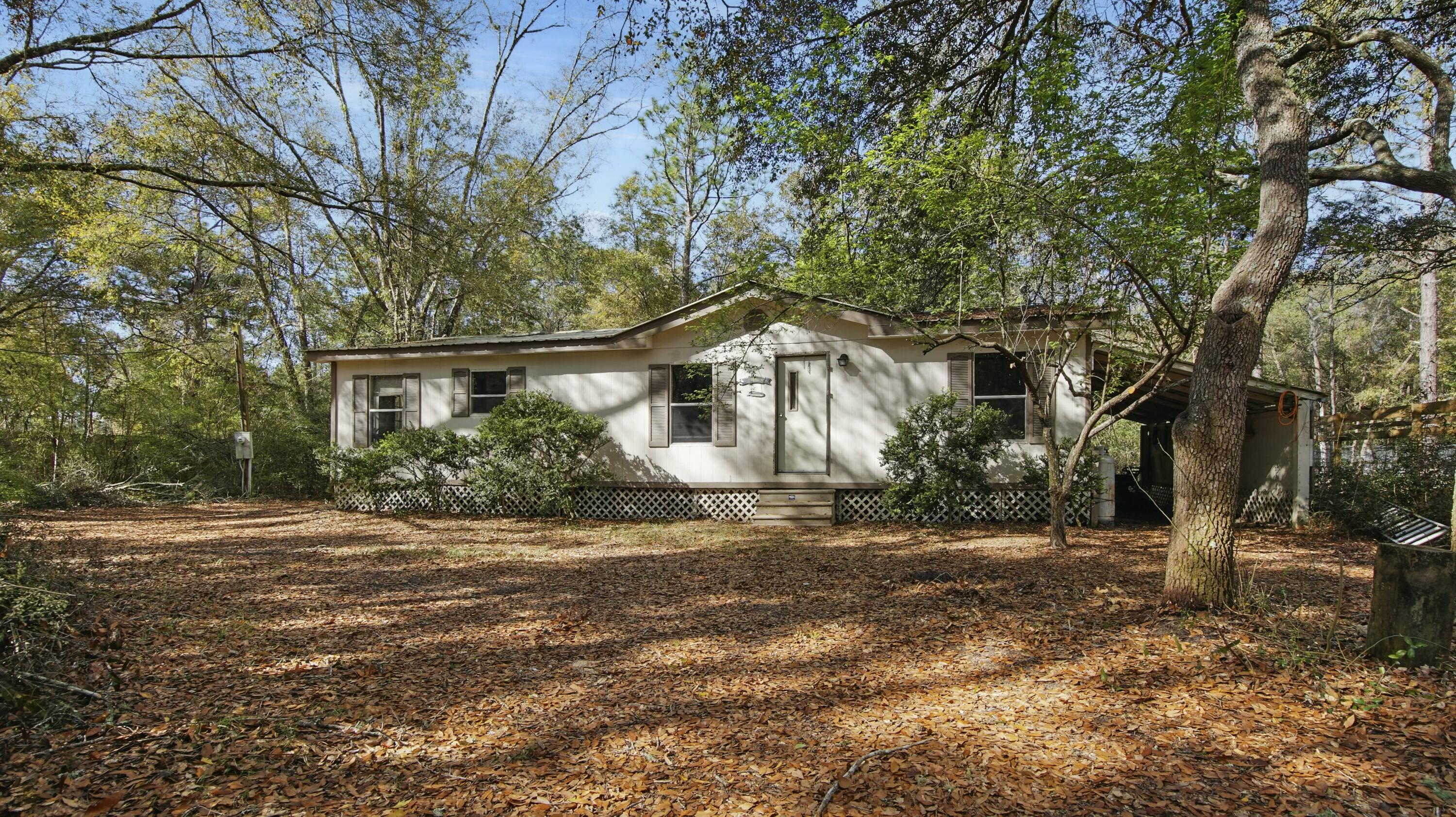 CASH PURCHASE ONLY NO LOANS ACCEPTED.. Discover the perfect opportunity for investment or customization with this 3-bedroom, 2-bathroom mobile home, nestled on a spacious .78-acre lot. This fixer-upper presents a fantastic chance to create your dream retreat or rental property, located just minutes away from the charming boat launch, making it an ideal spot for water enthusiasts.Conveniently situated near the newly renovated restaurant, The Outpost, you'll have dining options at your doorstep, perfectly balancing tranquility with community connection. Additionally, the property lies in close proximity to the upcoming master-planned community, NatureView, providing potential for future growth and development. The generous plot offers ample room for landscaping, outdoor activities, and expansion possibilities. This mobile home is an ideal canvas for your creativity and renovation vision. Don't miss the chance to transform this property into a vibrant and personalized living space while enjoying the benefits of its prime location. Call today before it's gone.