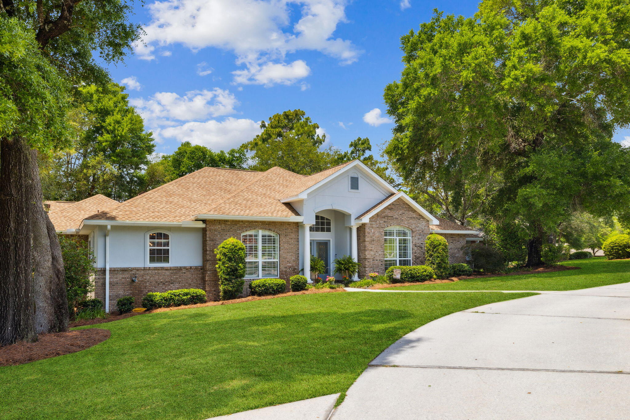 Located in desirable Rocky Bayou Estates on Kildare Circle, this well-maintained two-story home sits on an oversized corner lot with outstanding curb appeal, a circular driveway, 3-car garage, and ample guest parking.The home offers 4 spacious bedrooms, 4 full bathrooms and a home office. The private upstairs suite could be perfect for guests, a theater room, or studio. One of the full bathrooms opens directly to the covered patio--ideal for future pool access--while the primary suite features its own luxurious en-suite bath with a rainfall shower head.Inside, enjoy soaring ceilings, a spacious kitchen, and a cozy fireplace that create a warm and inviting atmosphere. The beautifully landscaped yard offers privacy and room to expand an outdoor living space or a pool addition. Enjoy covenants and restrictions but NO HOA FEES. Less than 4 miles to a public boat launch and 13 miles to Gulf beaches. Don't miss your chance to own a standout property in one of Niceville's most established communities